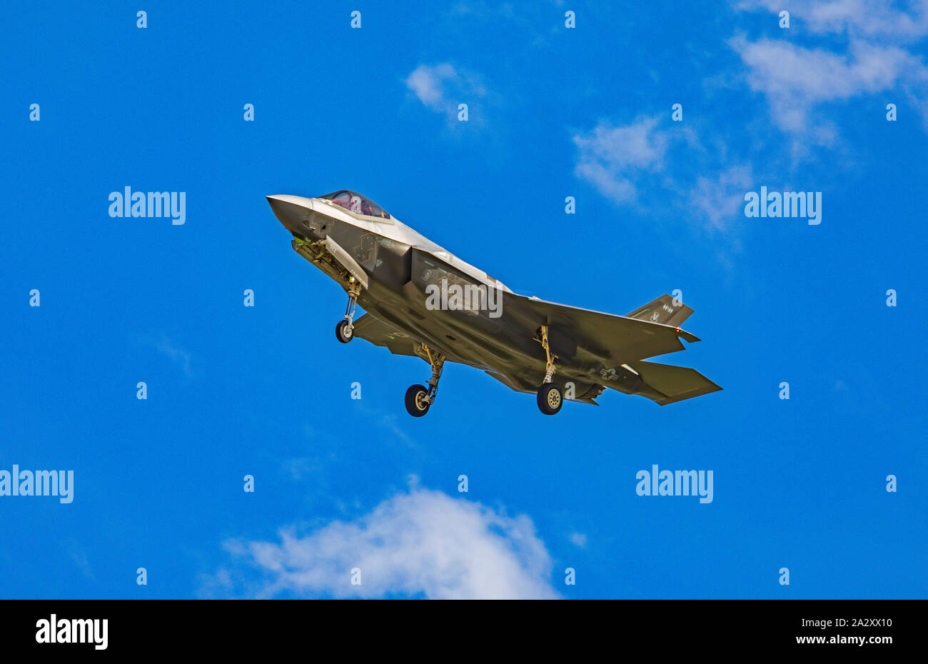 A  Lockheed Martin F-35A Lightning II jet fighter lines up with the runway to land at Hill Air Force Base after training on Utah's west desert range. Stock Photo