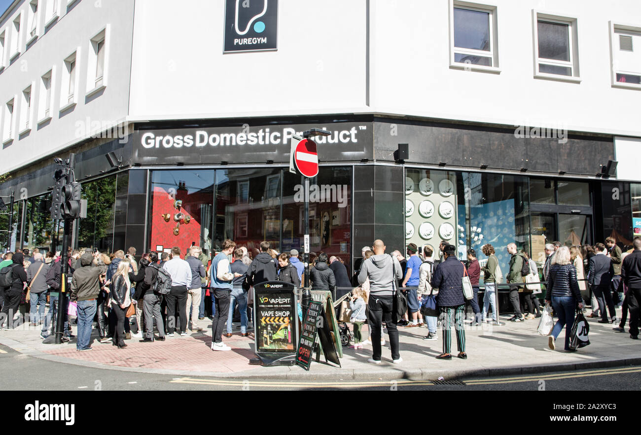 London, UK - October 2, 2019: Crowds looking at the art on display by Banksy at the street artist's Gross Domestic Product shop in Croydon, South Lond Stock Photo