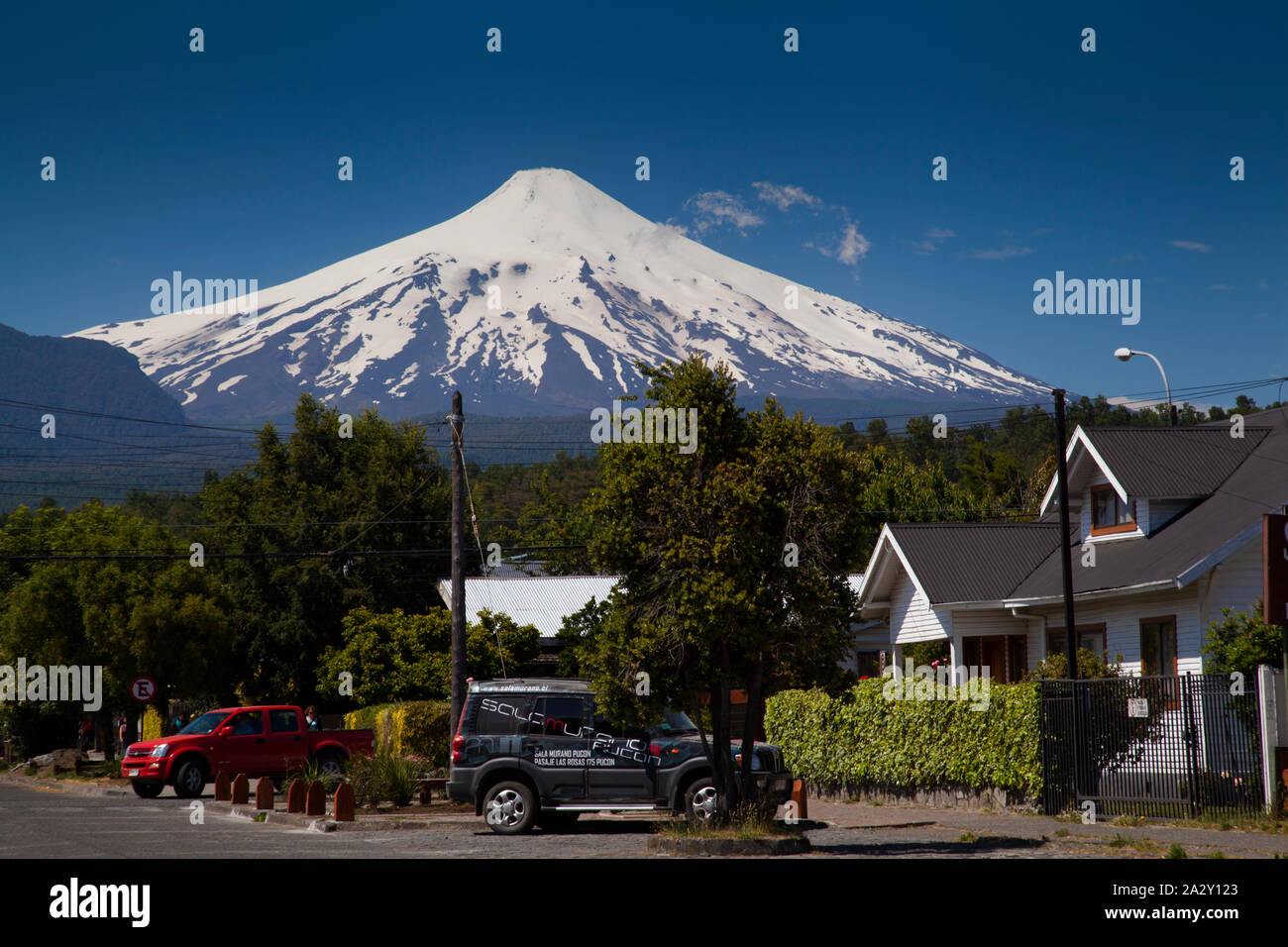 Volcano Villarica looms about the town of Pucon, Chile Stock Photo