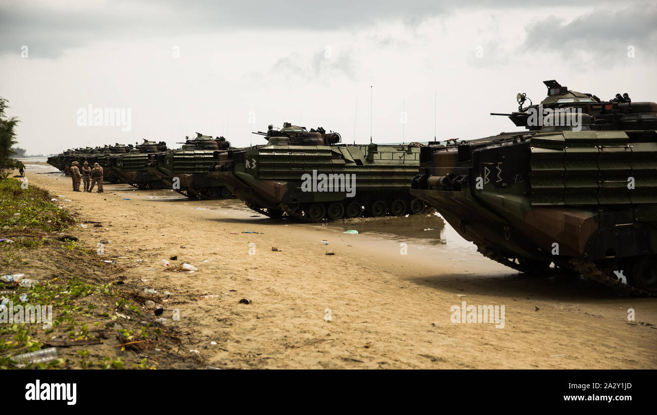 U.S. Marines with Assault Amphibious Vehicle (AAV) D Company, 4th Marine Regiment, 3rd Marine Division, stage AAVs during exercise Tiger Strike 2019 at Blue Beach, Malaysia, on Oct. 2, 2019. Tiger Strike 19 focuses on strengthening joint military interoperability and on increasing readiness by practicing for humanitarian assistance, disaster relief, amphibious and jungle warfare operations, all while fostering cultural exchanges between the MAF and the U.S. Navy, Marine Corps team. (U.S. Marine Corps photo by Cpl. Josue Marquez) Stock Photo