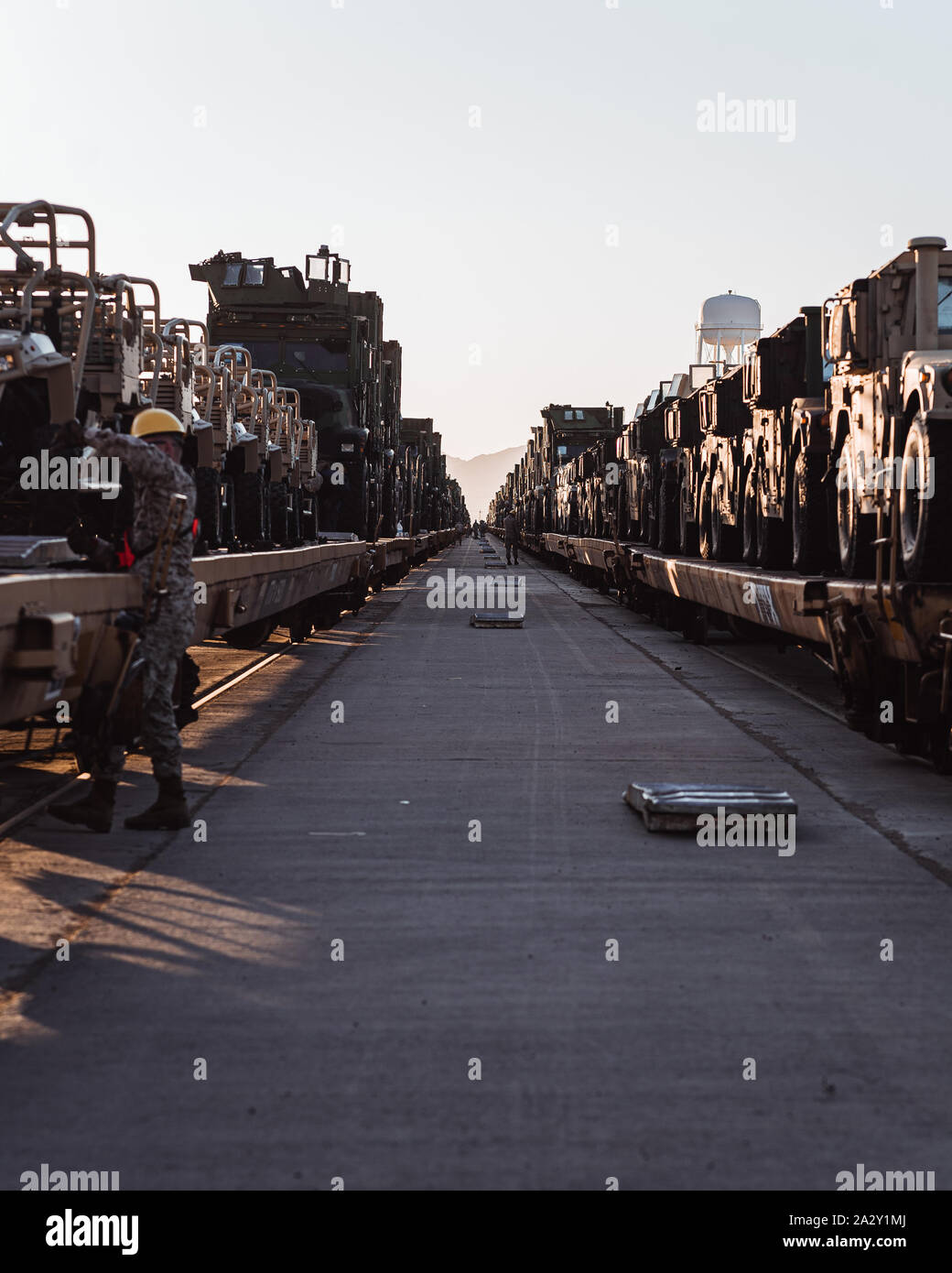 U.S. Marines with 2nd Marine Division unload tactical vehicles from a locomotive at Marine Corps Logistics Base, Barstow, Oct. 1, 2019. The vehicles will be used in the upcoming Integrated Training Exercise taking place at Marine Corps Air Ground Combat Center Twentynine Palms. (U.S. Marine Corps Photo by Lance Cpl. Corey Mathews) Stock Photo