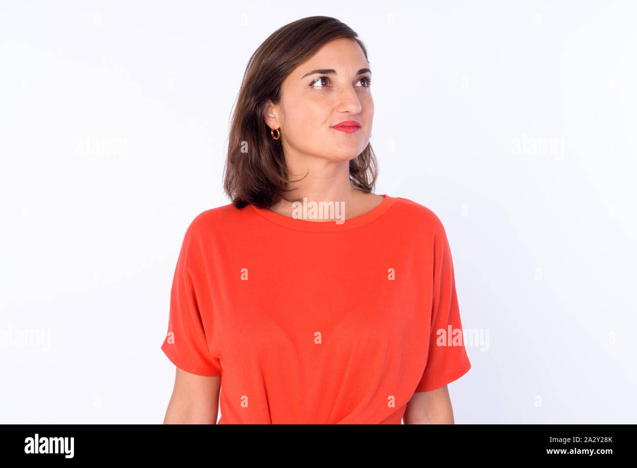 Portrait of beautiful woman thinking and looking up Stock Photo - Alamy