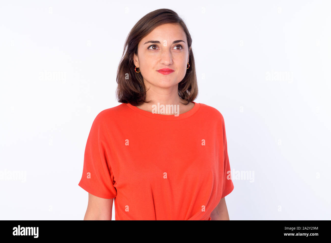 Portrait of beautiful woman thinking and looking up Stock Photo - Alamy