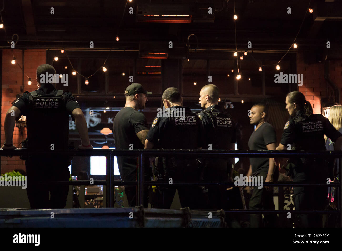 VANCOUVER, BC, CANADA - SEPT 7, 2019: The Vancouver Police' Gang Unit questioning a member of the public during the week of increase violent crime on Stock Photo