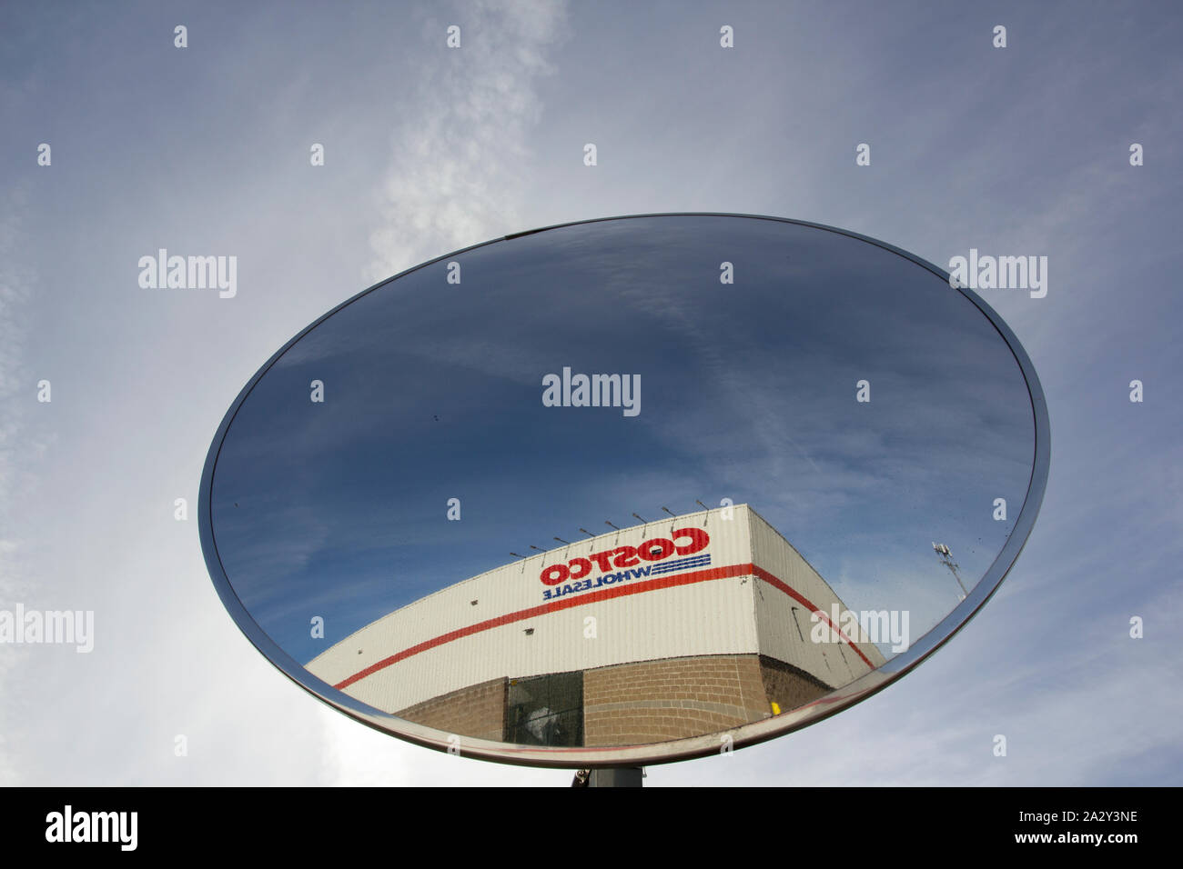 Tigard, Oregon - Mar 15, 2019: The sign of Costco Wholesale seen from a traffic safety mirror at a Costco Wholesale store. Stock Photo