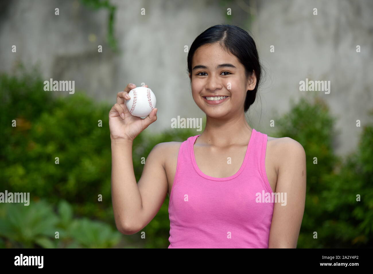 Smiling Athlete Minority Female Baseball Player Stock Photo