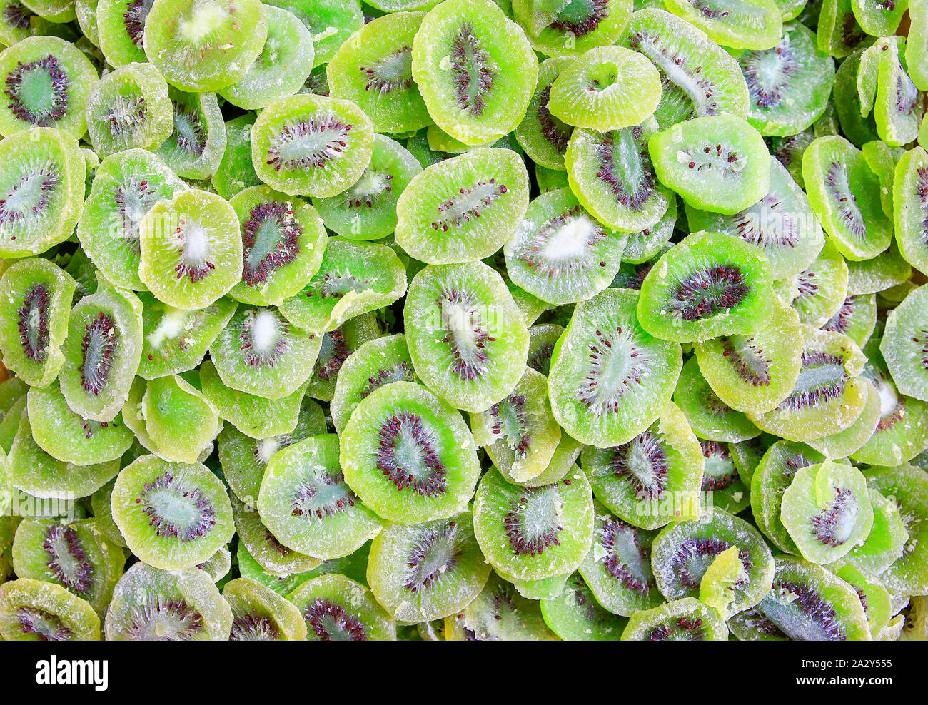 Heap of dry green kiwi slices for sale at market Stock Photo
