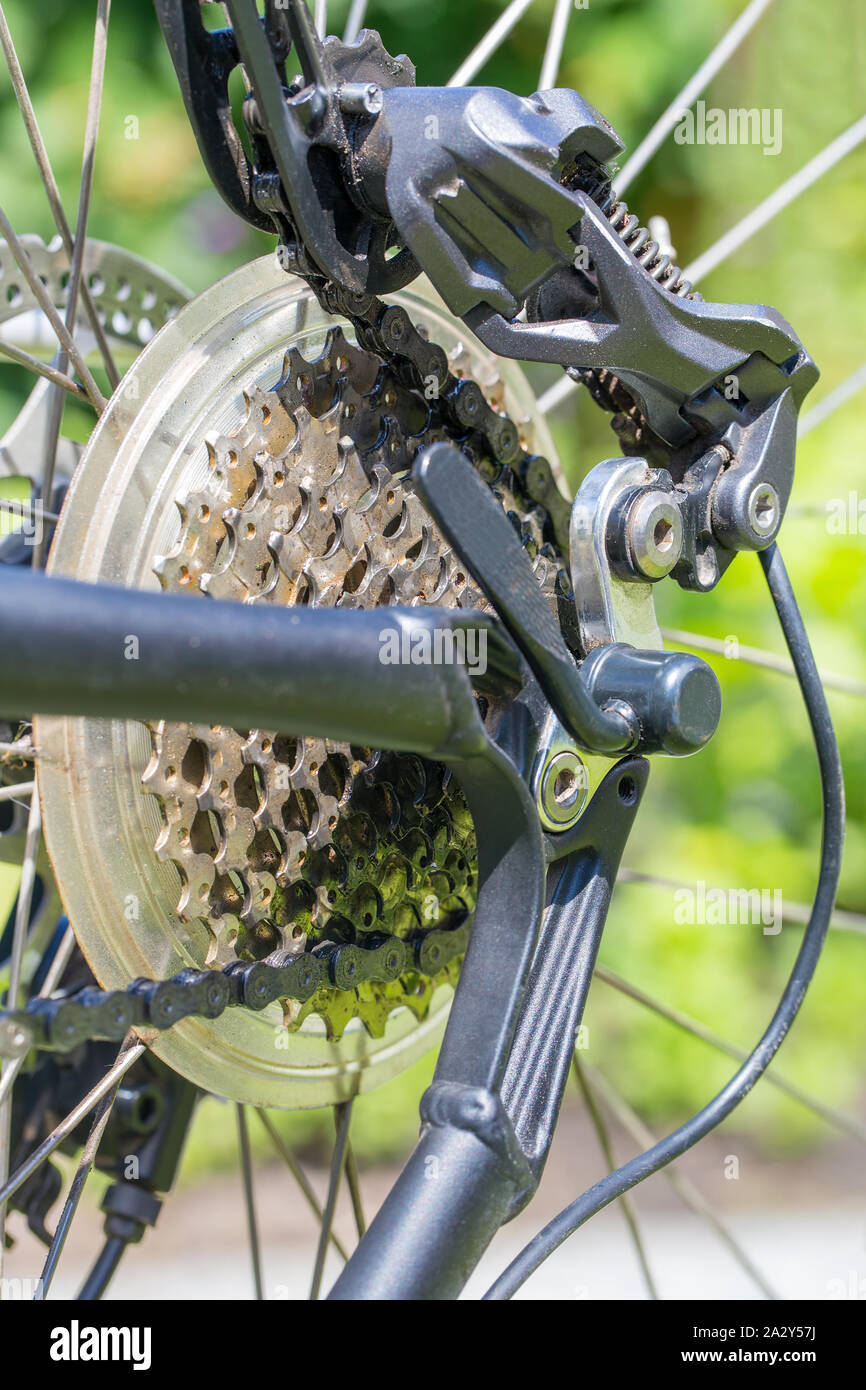 Rear wheel of bike with sprocket chain and derailleur Stock Photo