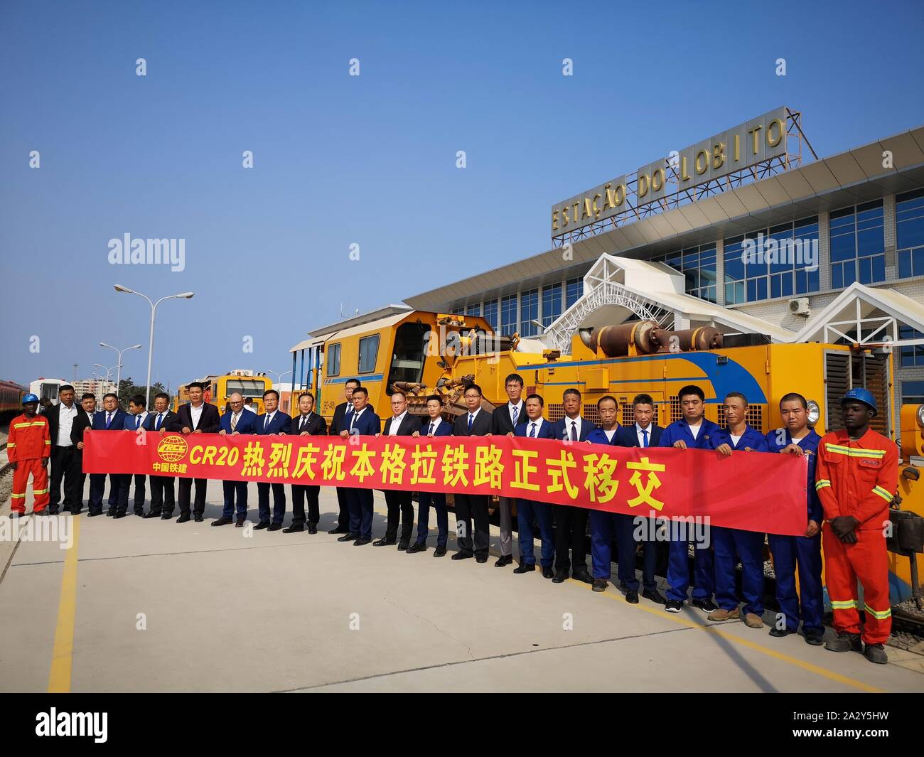 Lobito, Angola. 3rd Oct, 2019. People attend the handover ceremony of the Benguela Railway in Lobito, Angola, Oct. 3, 2019. The Benguela Railway, which was built by the China Railway 20 Bureau Group Corporation (CR20), was officially handed over to Angola in the port city of Lobito on Thursday. The 1,344-km railway runs through Angola, from west of the Atlantic port city of Lobito, eastward through important cities such as Benguela, Huambo, Kuito and Luena, and reaches the border city of Luao, bordering the Democratic Republic of the Congo. Credit: Liu Zhi/Xinhua/Alamy Live News Stock Photo