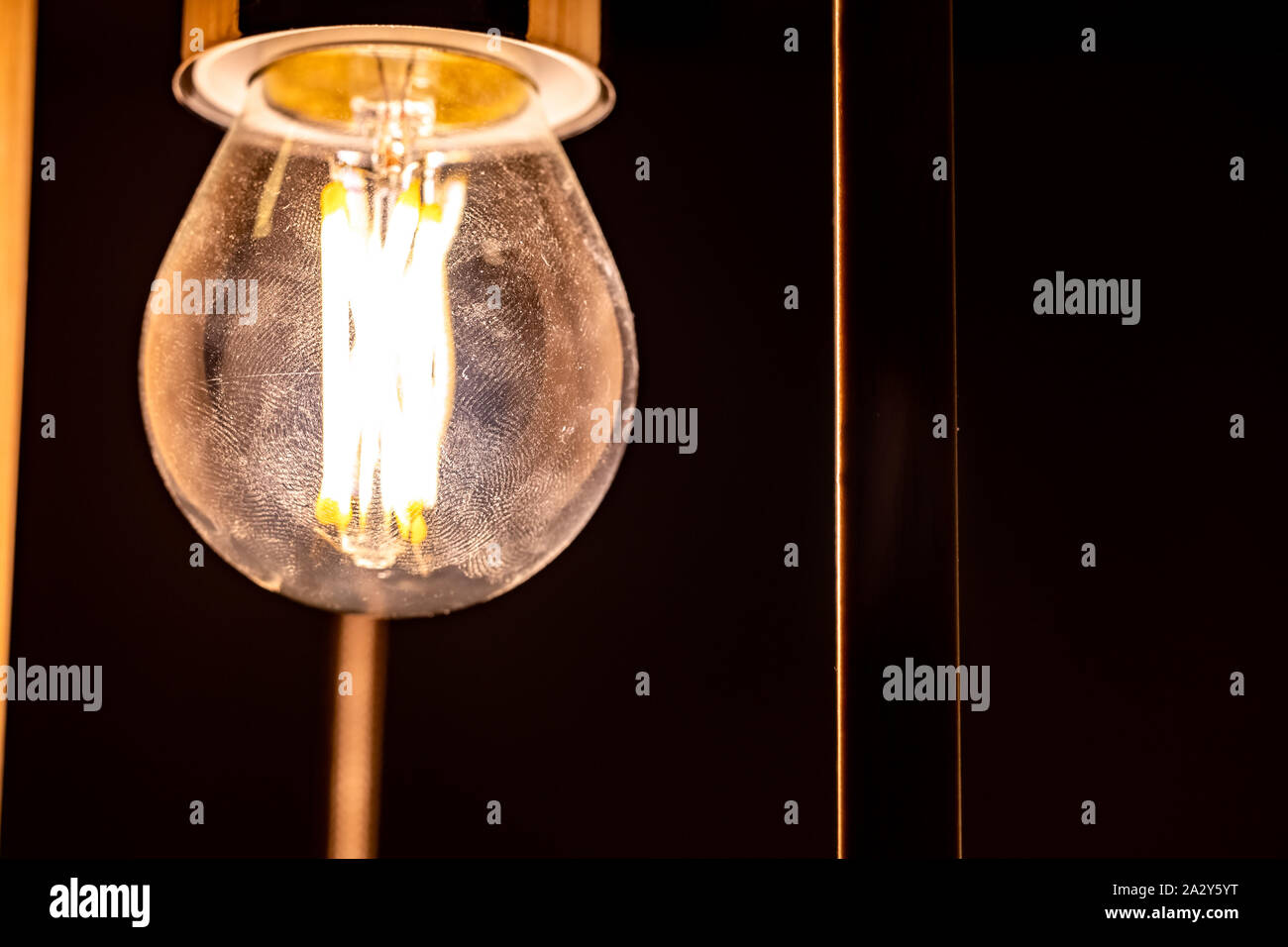 Light bulb glowing in the dark Stock Photo Alamy