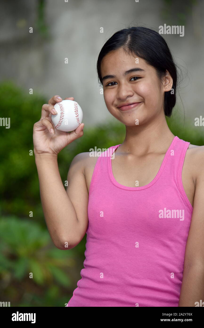 Happy Asian Female Athlete With Baseball Stock Photo
