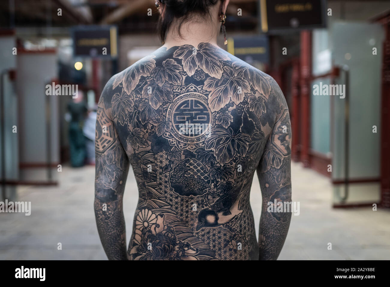 15th International London Tattoo Convention at Tobacco Dock. One of the  most prestigious body art conventions in the world. London, UK Stock Photo 