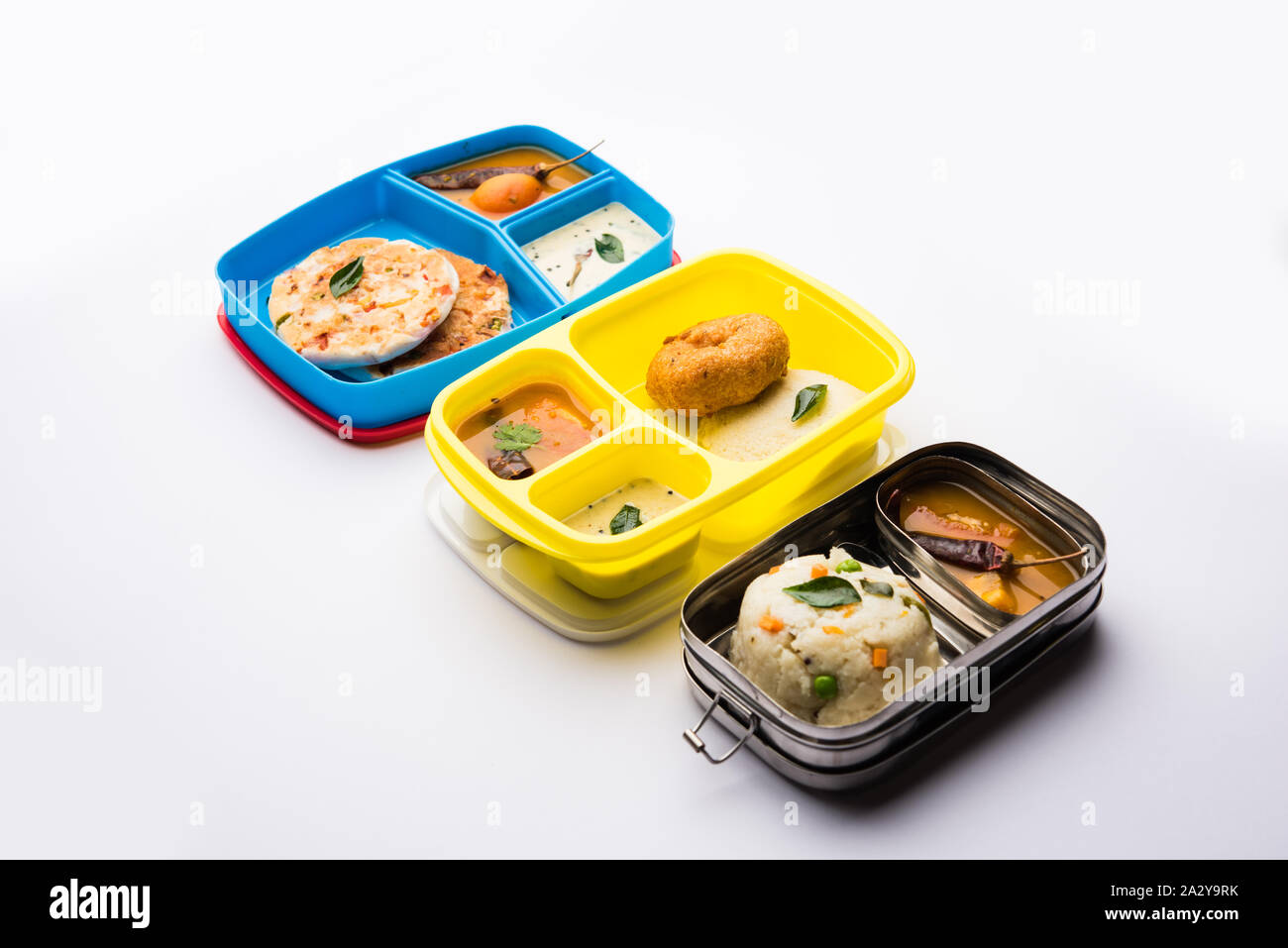 Assorted South Indian tiffin / lunch box food in group, includes idli