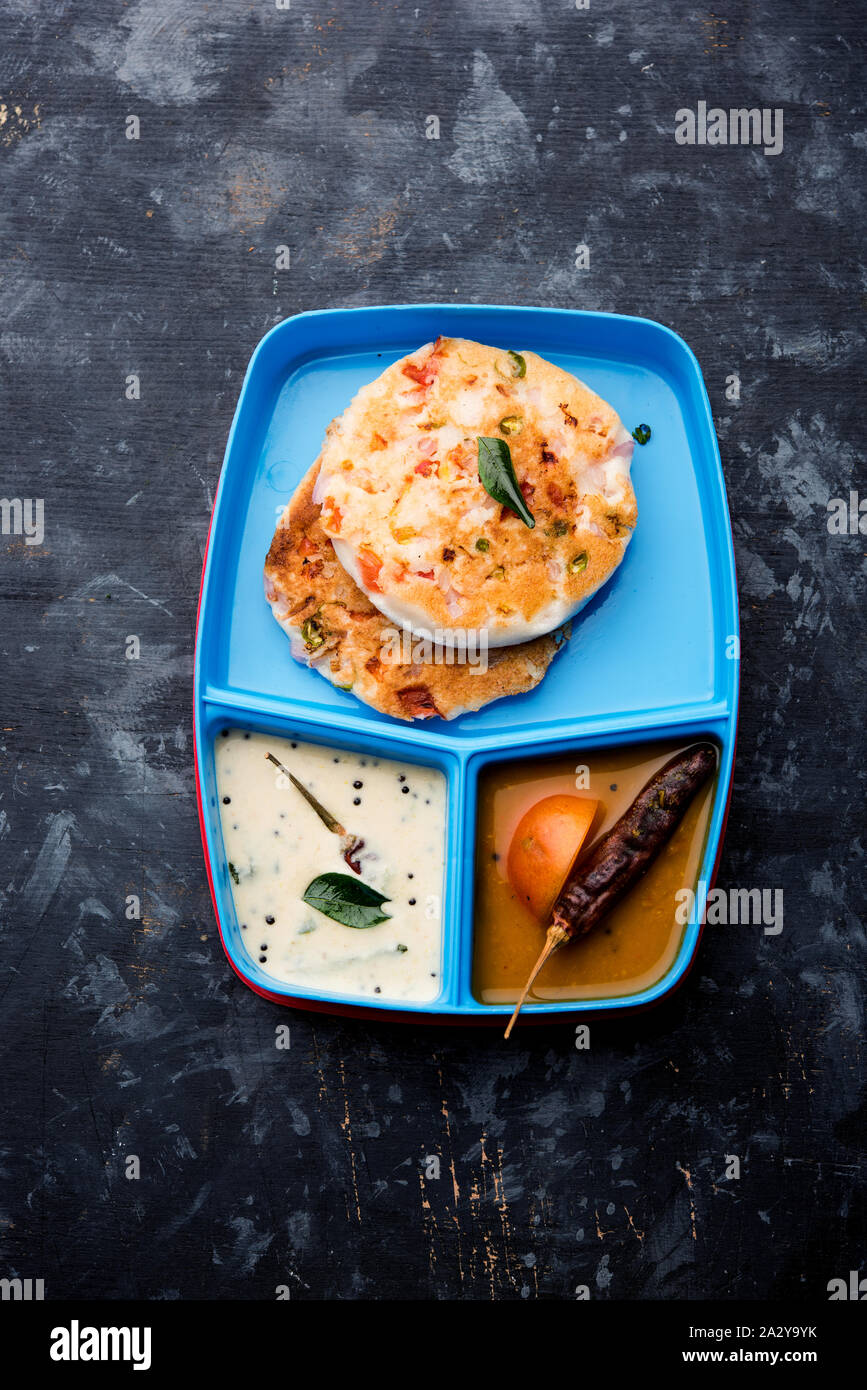 uttapam / uthappam sambar chutney in lunch box or tiffin Stock Photo