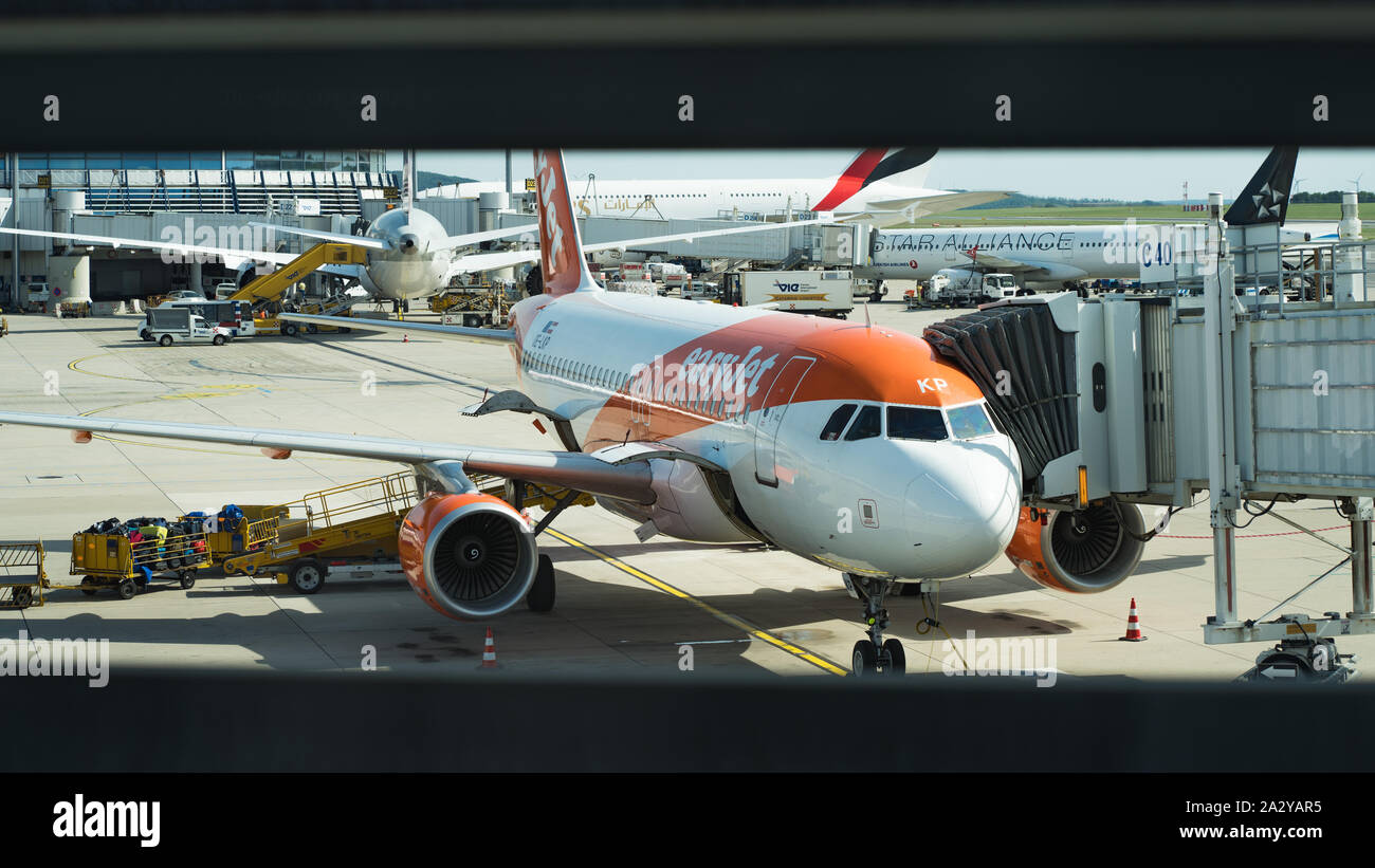 Close up of Easy jet airbus connected with Passenger boarding bridge at International Vienna Airport Stock Photo