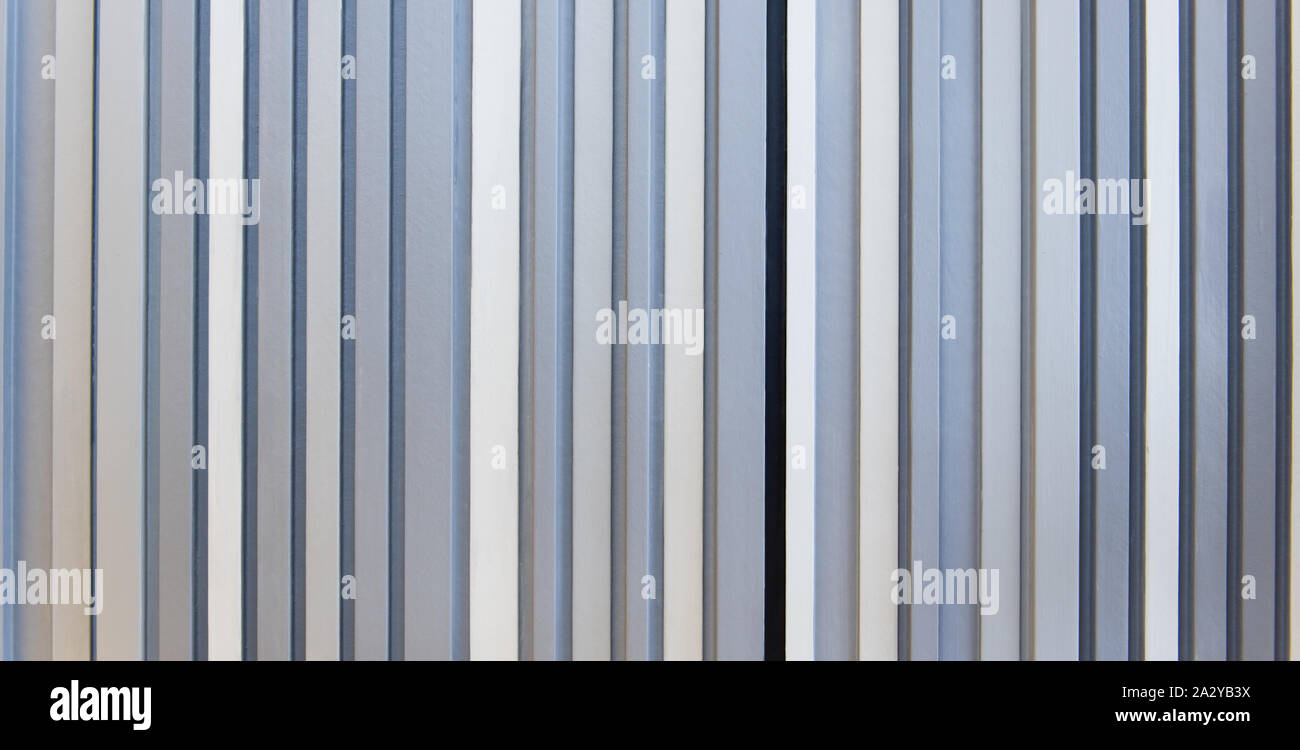 Wall style pattern vertical dark and light white gray and black color made of wood. Background, wallpaper, and texture. Stock Photo