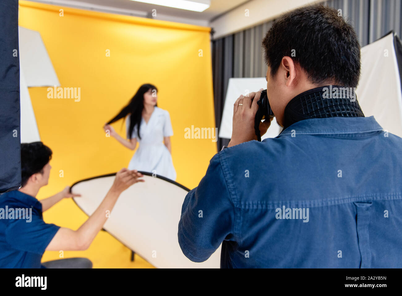 Behind the scenes, photographers are using cameras and lenses to