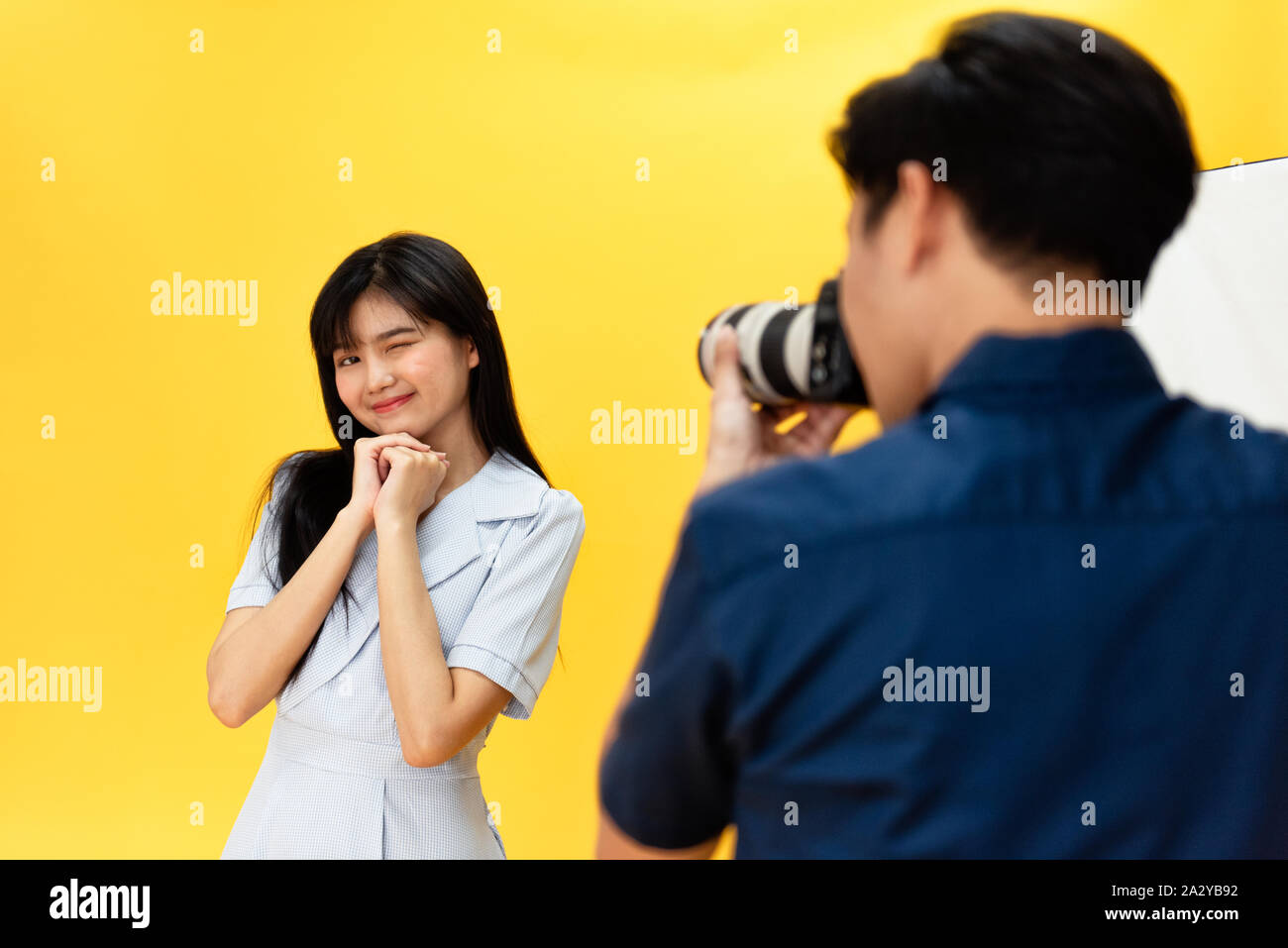 Behind the scenes, photographers are using cameras and lenses to