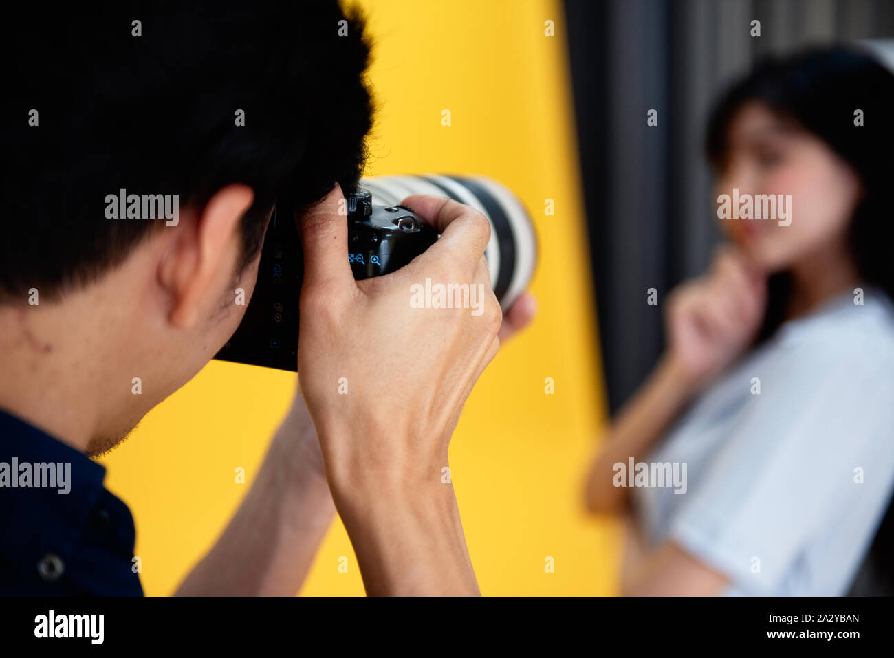 Behind the scenes, photographers are using cameras and lenses to