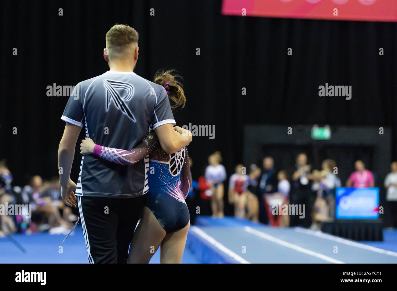 Birmingham, England, UK. 28 September 2019. Head coach Rob Owen (l) and gymnast Alicia Field (r) (Revolution Gymnastics Club) in action during the Trampoline, Tumbling and DMT British Championship Qualifiers at the Arena Birmingham, Birmingham, UK. Stock Photo