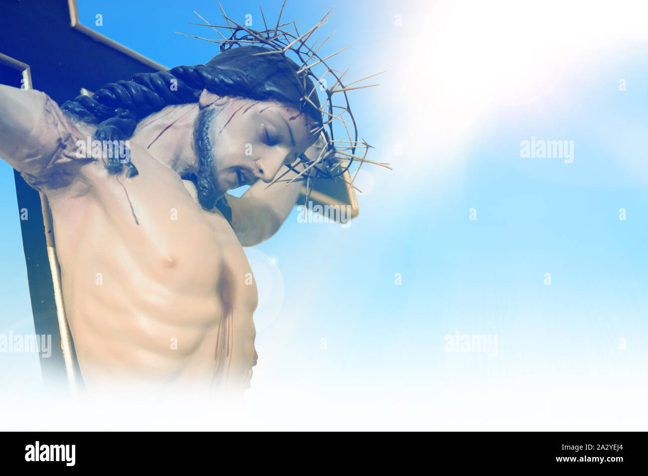 Jesus Christ on the cross against a background of blue sky Stock Photo ...