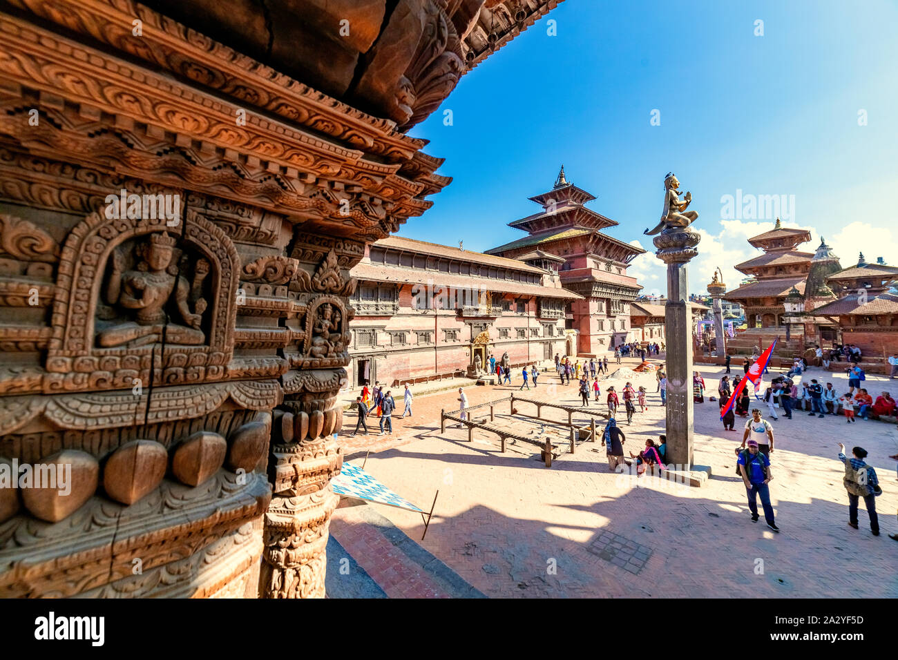 People walking around Patan Durbar Square, a UNESCO Heritage site in Nepal. Temples reconstruction after Earthquake. Stock Photo