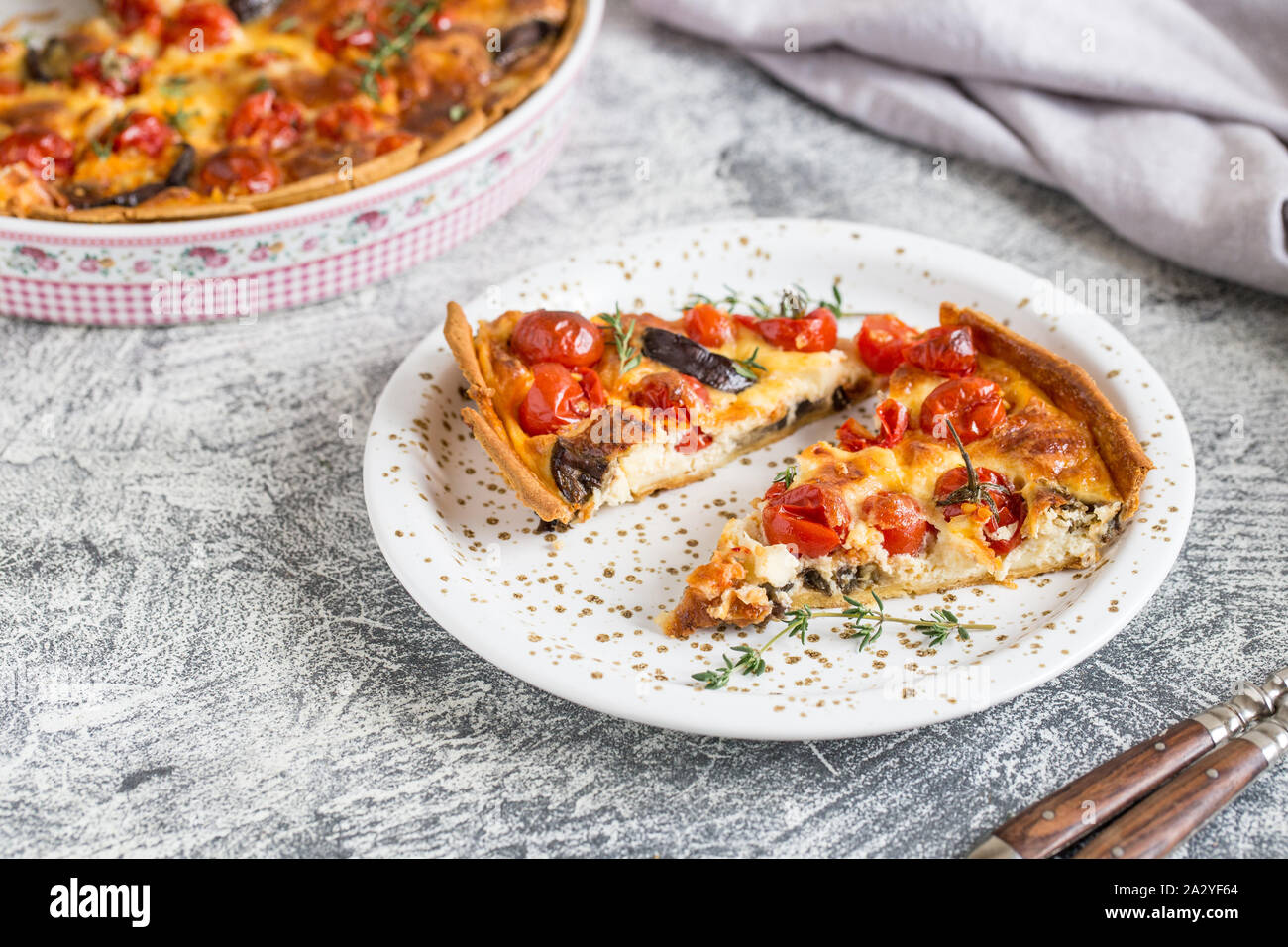 Vegetarian homemade pie, Quiche with cherry tomatoes, eggplant and feta