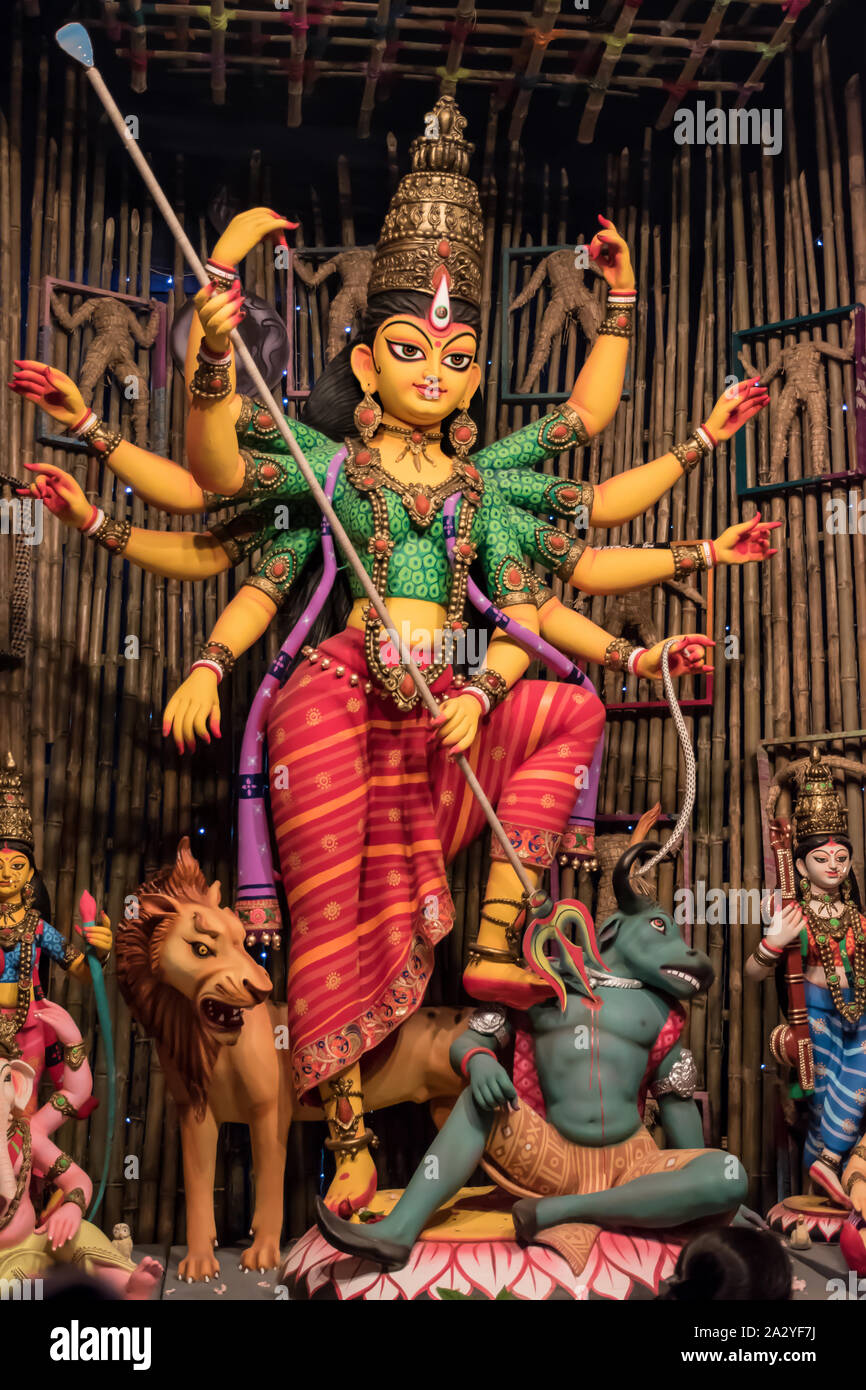 Goddess Durga Idol At Decorated Durga Puja Pandal Shot At Colored Light At Kolkata West