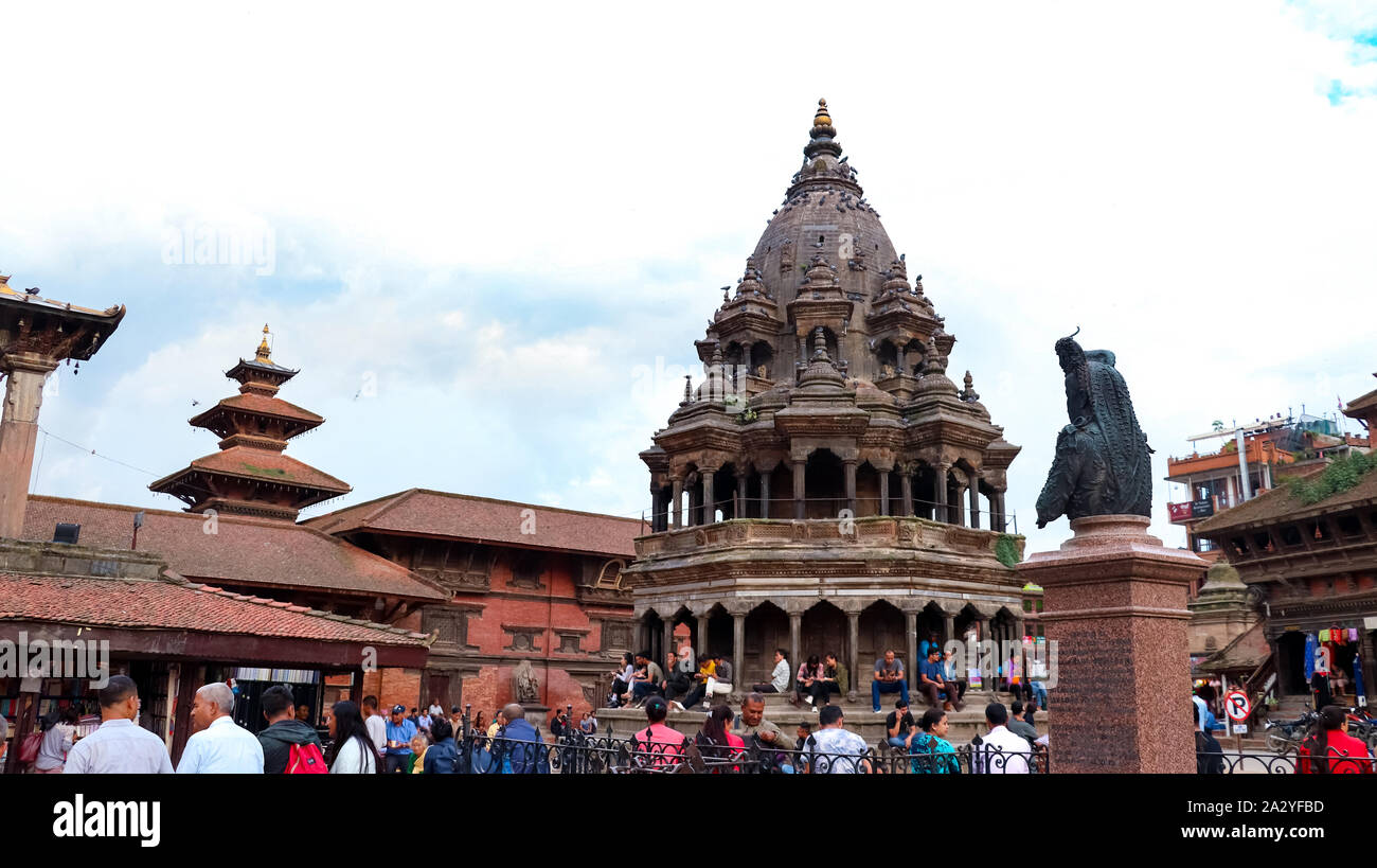 People walking around Patan Durbar Square, a UNESCO Heritage site in Nepal. Temples reconstruction after Earthquake. Stock Photo