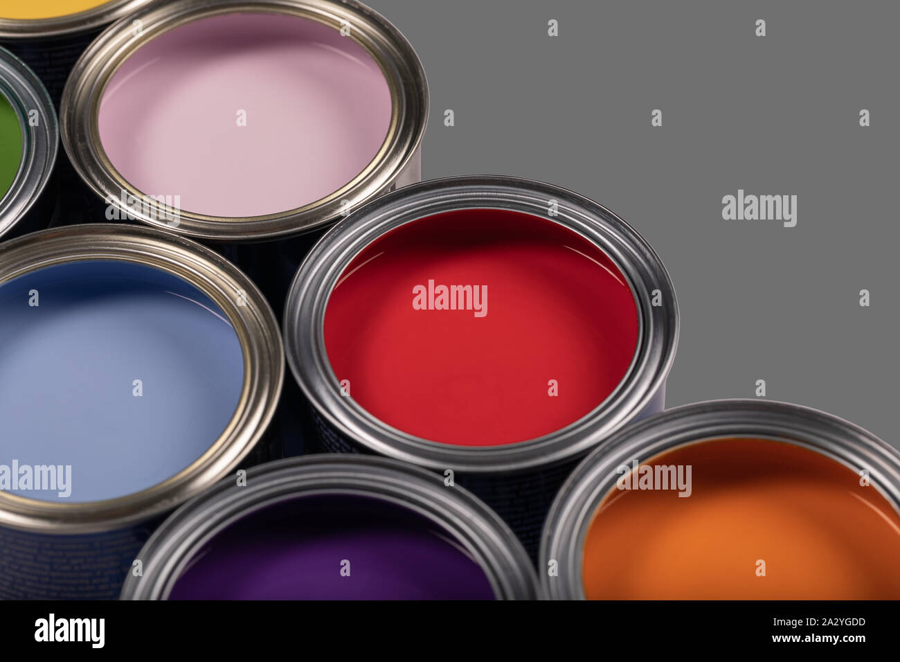 Various paint tins on a grey background with copy space Stock Photo Alamy