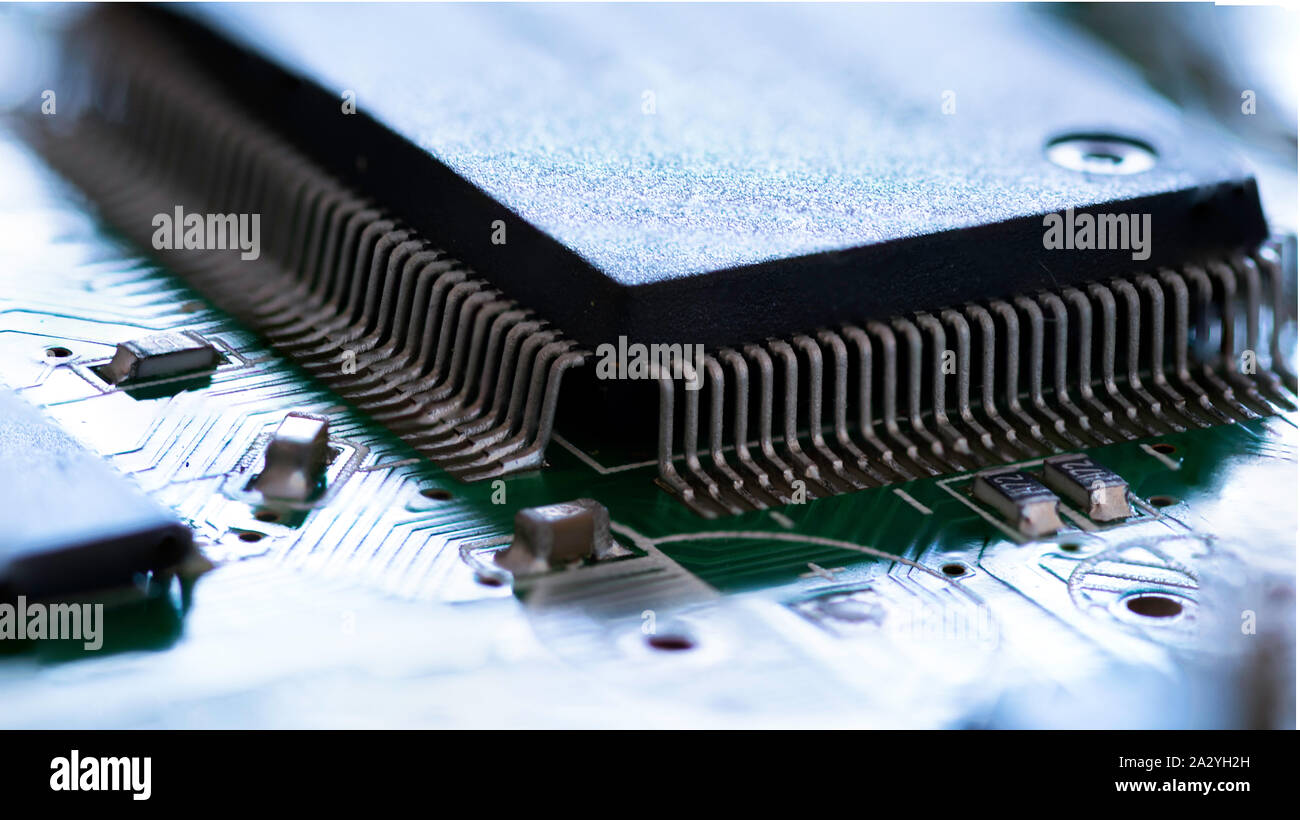 Electronic circuit board close up with processor. Small depth of field. Stock Photo