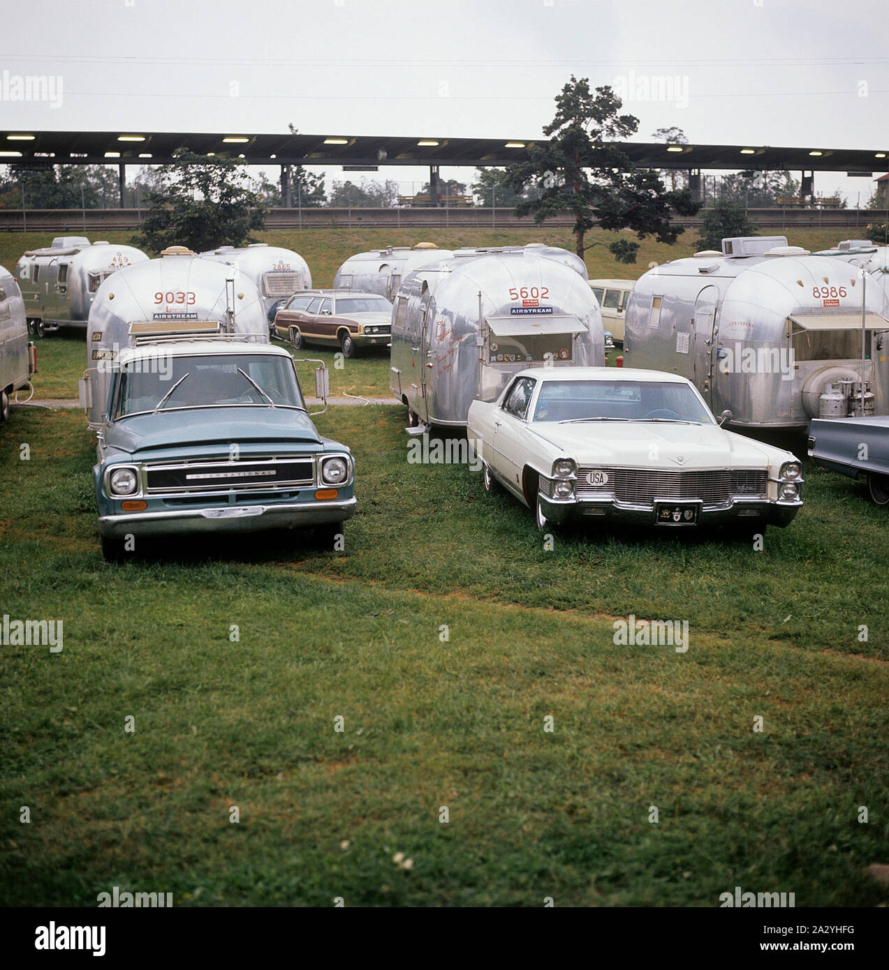 1970s camping. Pictured an American Airstream caravan in aluminium and in the typical 1930s streamline design. The caravan was designed by Hawley Bowlus who was inspirered by the airplane Spirit of St. Louis. Around the world, owners of Airstream caravans meet and this picture was taken in Sweden on September 21 1971. Stock Photo