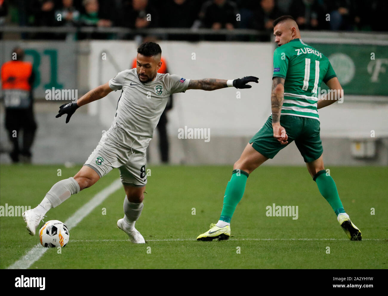 BUDAPEST, HUNGARY - OCTOBER 3: (l-r) Wanderson of PFC Ludogorets 1945 dribbles next to Oleksandr Zubkov of Ferencvarosi TC during the UEFA Europa League Group Stage match between Ferencvarosi TC and PFC Ludogorets 1945 at Ferencvaros Stadium on October 3, 2019 in Budapest, Hungary. Stock Photo