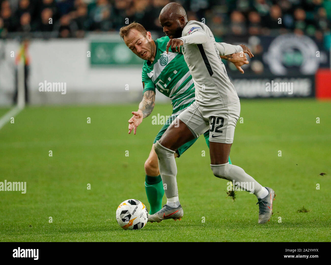 BUDAPEST, HUNGARY - OCTOBER 3: (l-r) Gergo Lovrencsics of Ferencvarosi TC competes for the ball with Jody Lukoki of PFC Ludogorets 1945 during the UEFA Europa League Group Stage match between Ferencvarosi TC and PFC Ludogorets 1945 at Ferencvaros Stadium on October 3, 2019 in Budapest, Hungary. Stock Photo