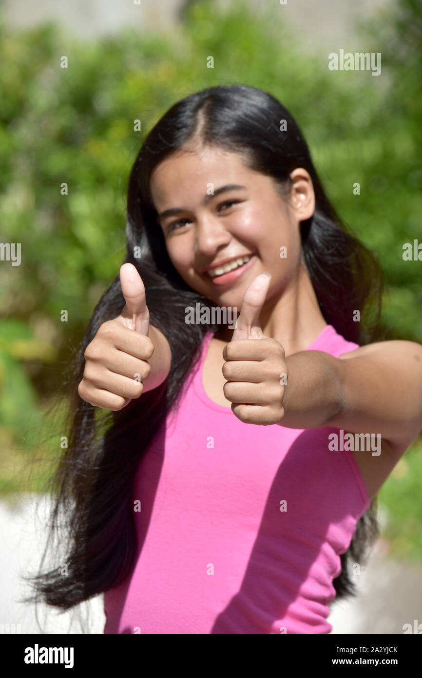 A Female Youngster With Thumbs Up Stock Photo