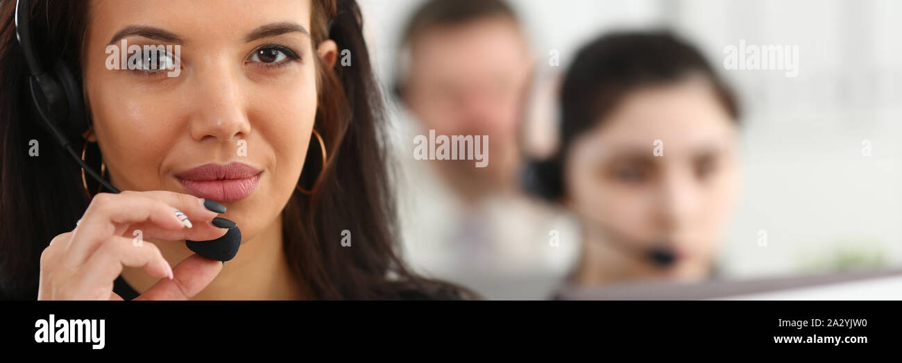 Three call centre service operators at work Stock Photo