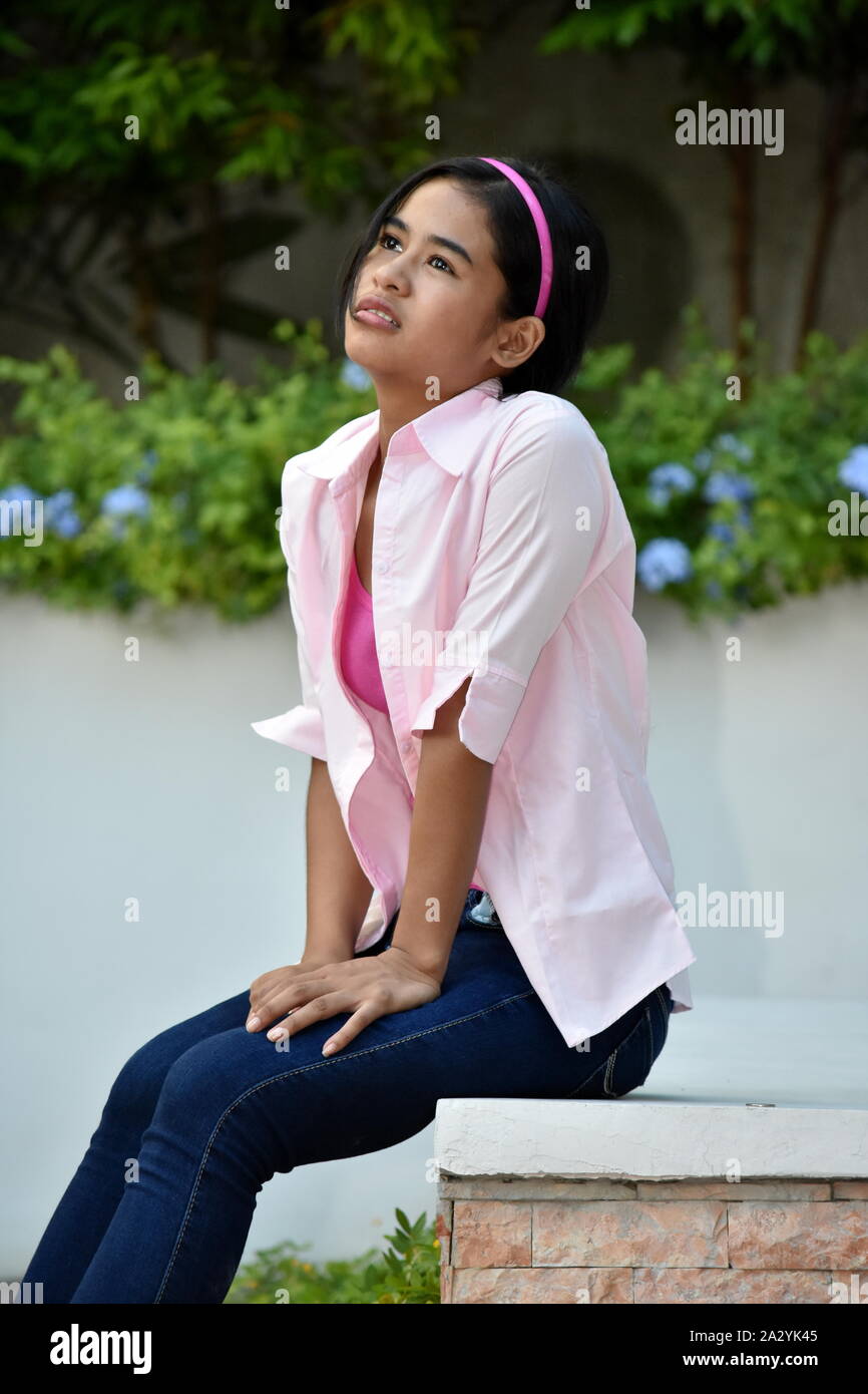 An A Contemplative Filipina Female Juvenile Stock Photo