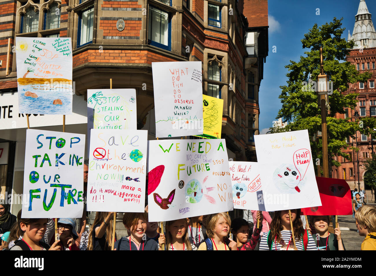 Children with homemade placards at the 20th September global climate strike, Old Market Square, Nottingham, Nottinghamshire, East Midlands, England Stock Photo