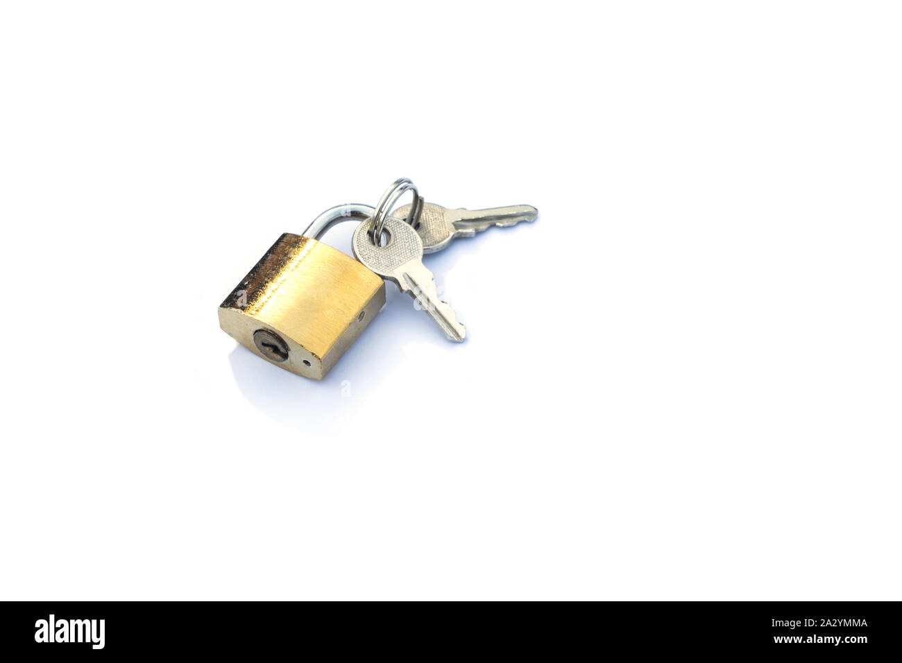 keys lies next to a padlock isolate on a white background Stock Photo