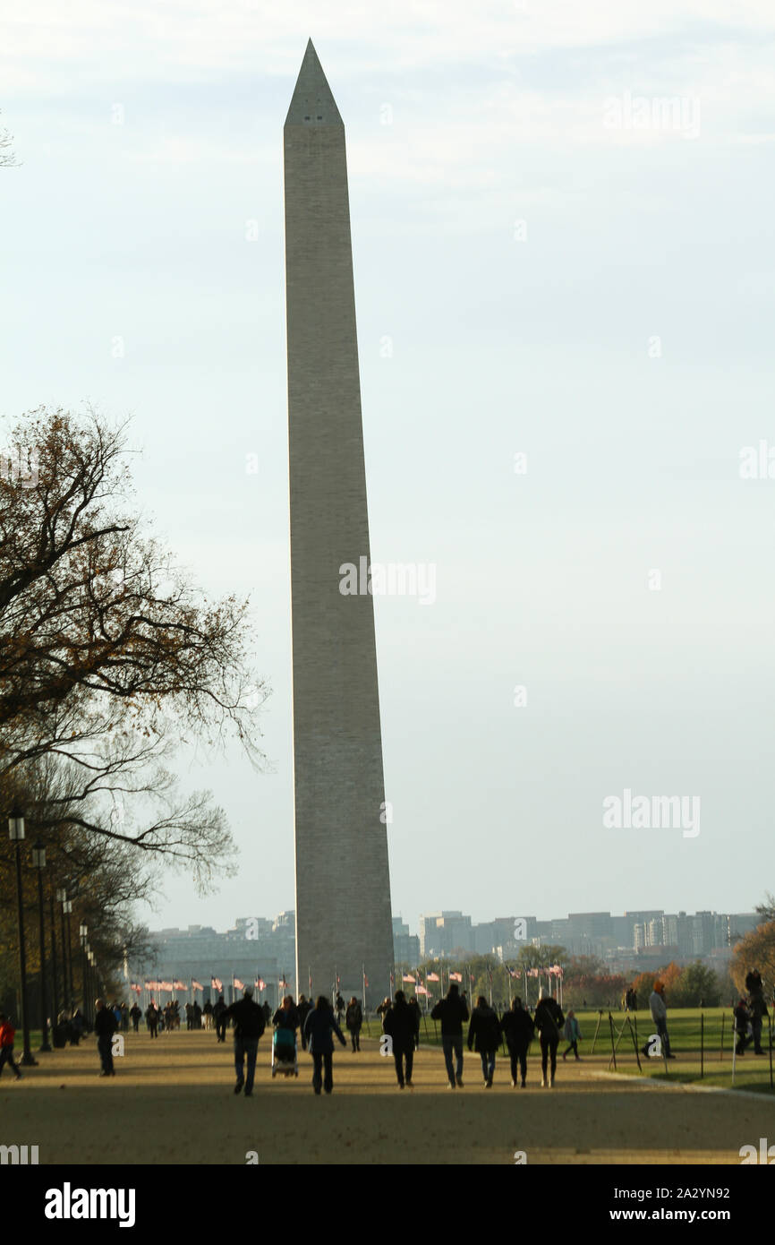 The Washington Monument in Washington DC, USA. People visiting the National Mall. Stock Photo