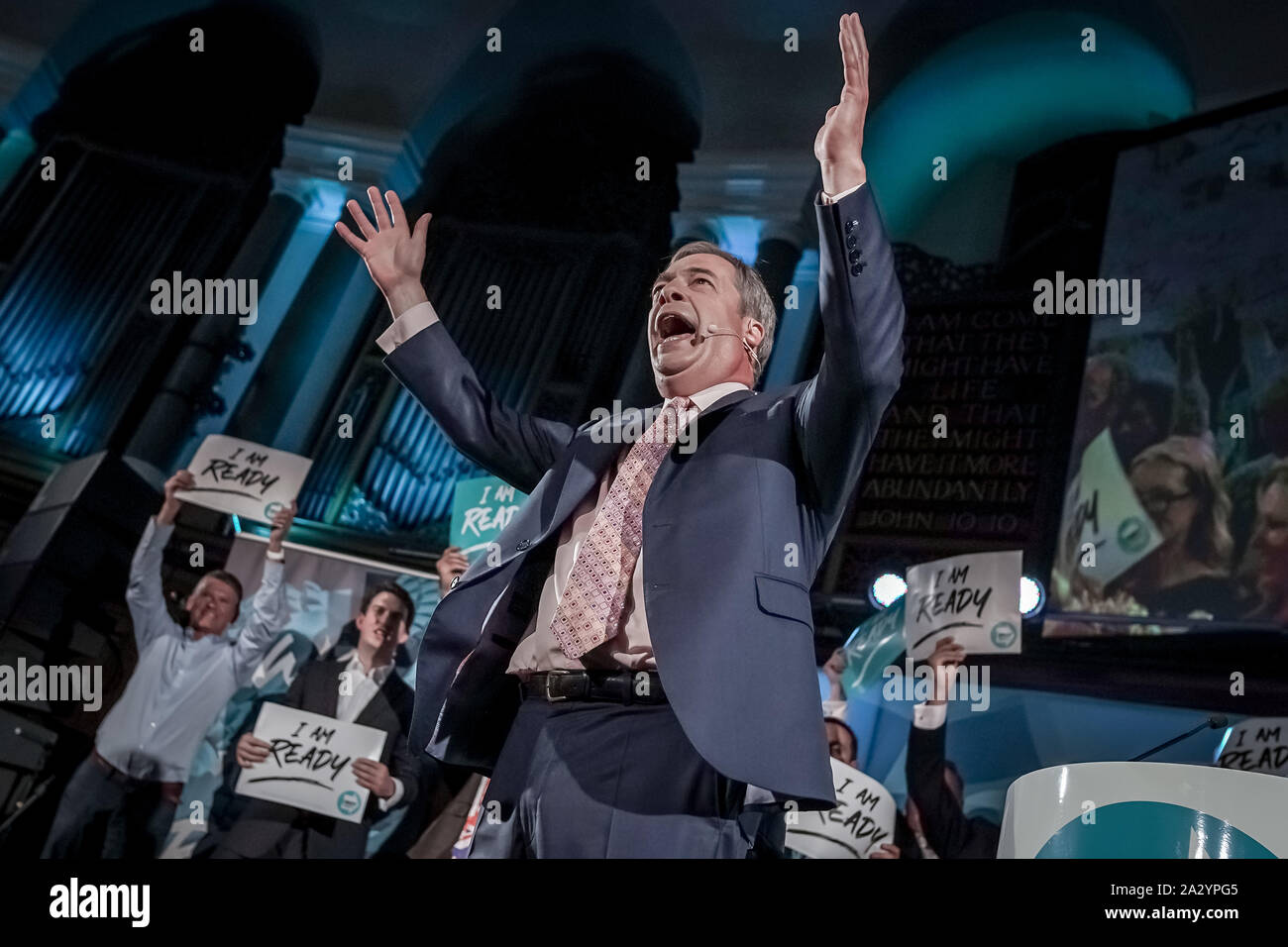 Nigel Farage takes the stage and addresses the crowd during The Brexit Party conference in Westminster as part of a nationwide party tour. London, UK Stock Photo