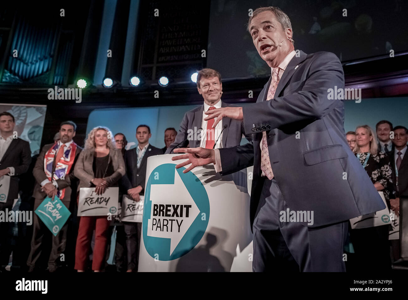 Nigel Farage takes the stage and addresses the crowd during The Brexit Party conference in Westminster as part of a nationwide party tour. London, UK Stock Photo