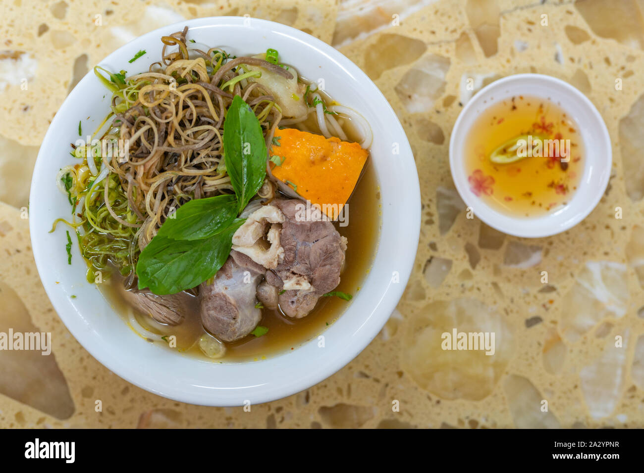 Traditional beef marrow bones noodle soup and vegetables Stock Photo