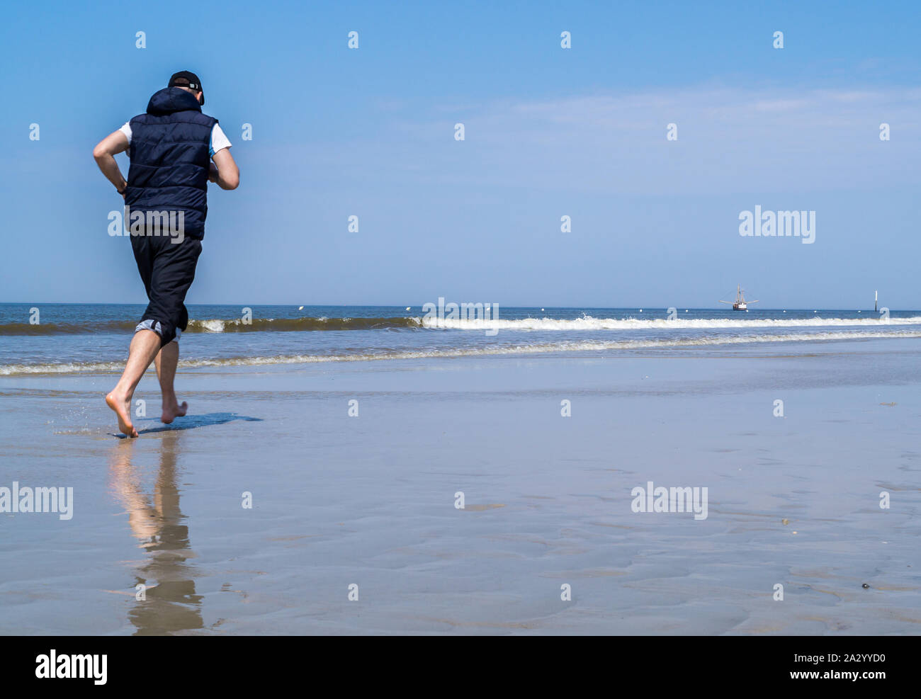 Jogging by the Sea Stock Photo