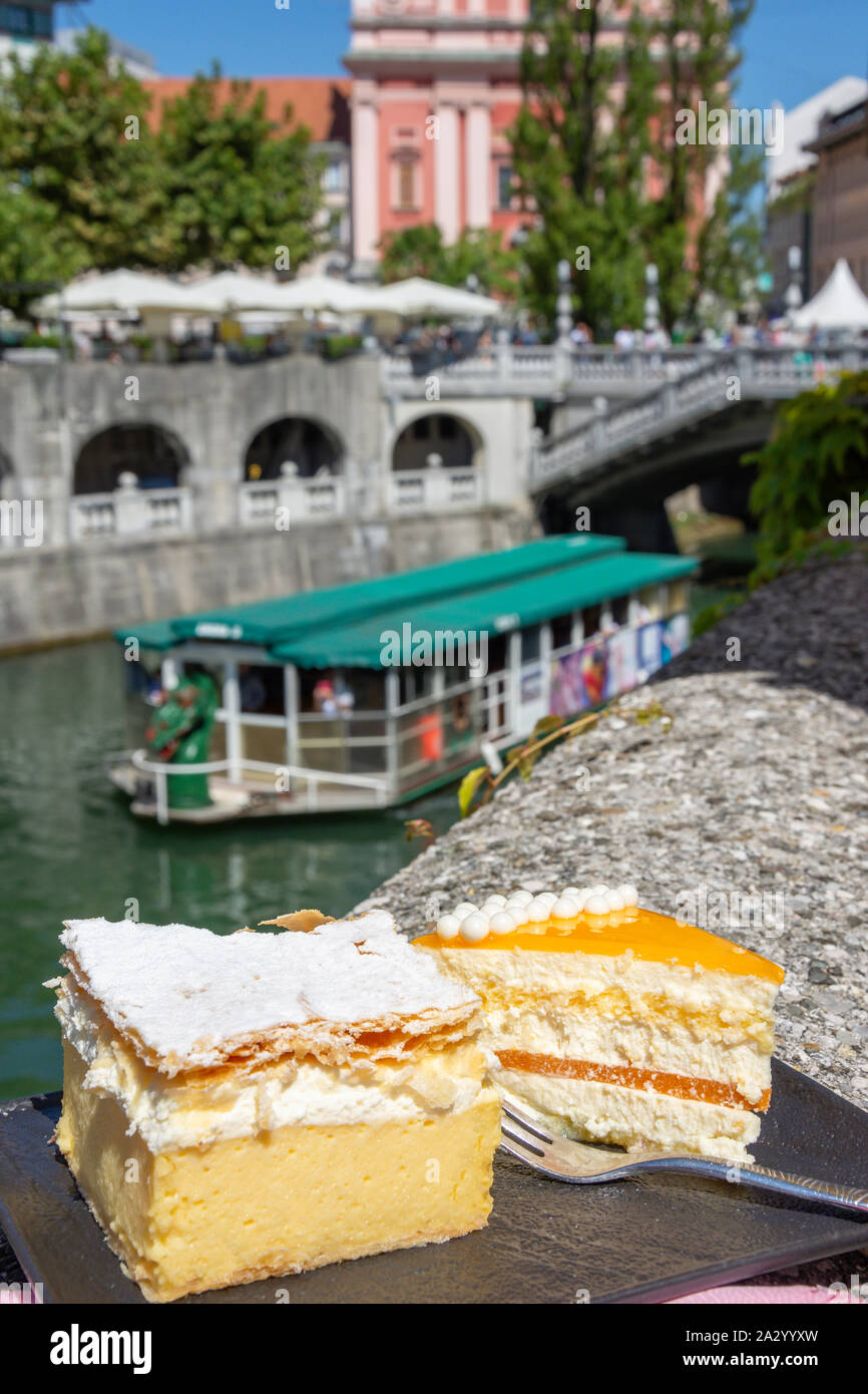 Traditional Kremšnita (Bled custard dessert) cakes on plate, Old Town, Ljubljana, Slovenia Stock Photo
