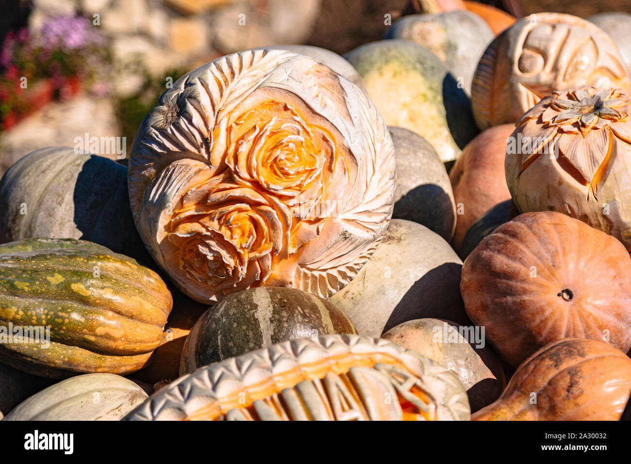 Carving on pumpking in fall farmer market or fair Stock Photo Alamy