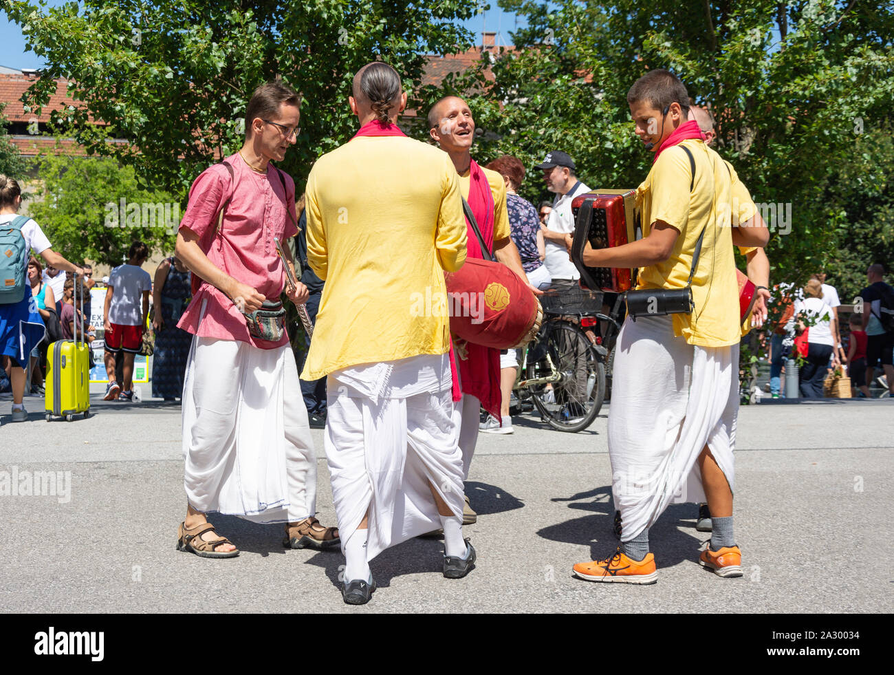 Hare Krishna followers chanting in street, Old Town, Ljubljana, Slovenia Stock Photo