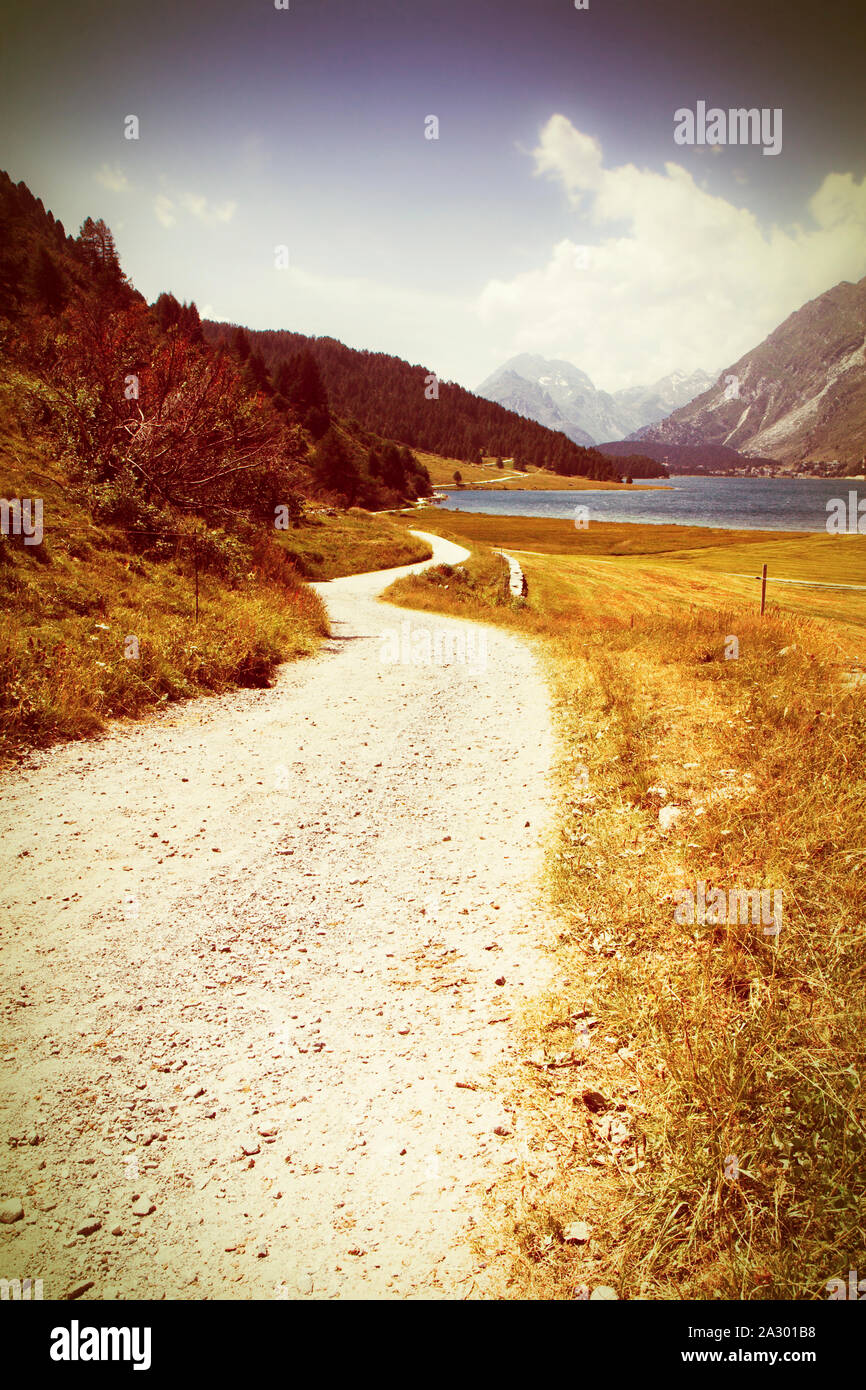 Country road around Sils Lake on upper Engadine Valley (Switzerland -  Europe) - Toned with a retro vintage instagram filter effect Stock Photo -  Alamy