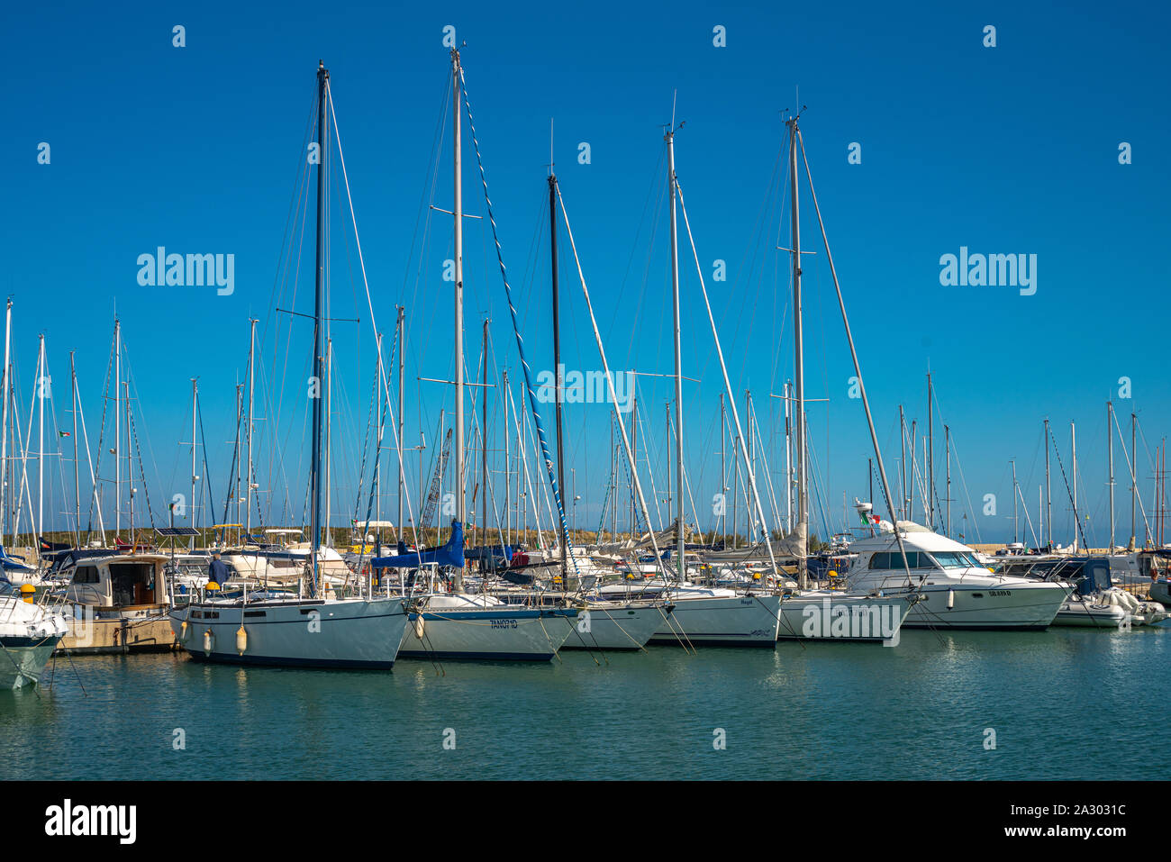 View of the Pescara tourist harbor with sail boats and yachts anchored Stock Photo