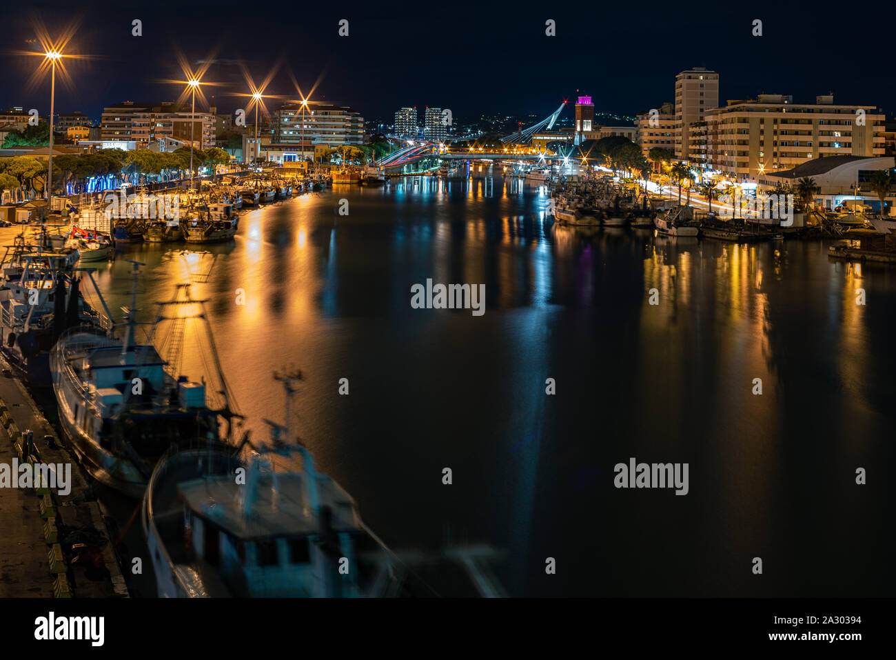 Port-canal of Pescara  seen at night from the Ponte del Mare Stock Photo
